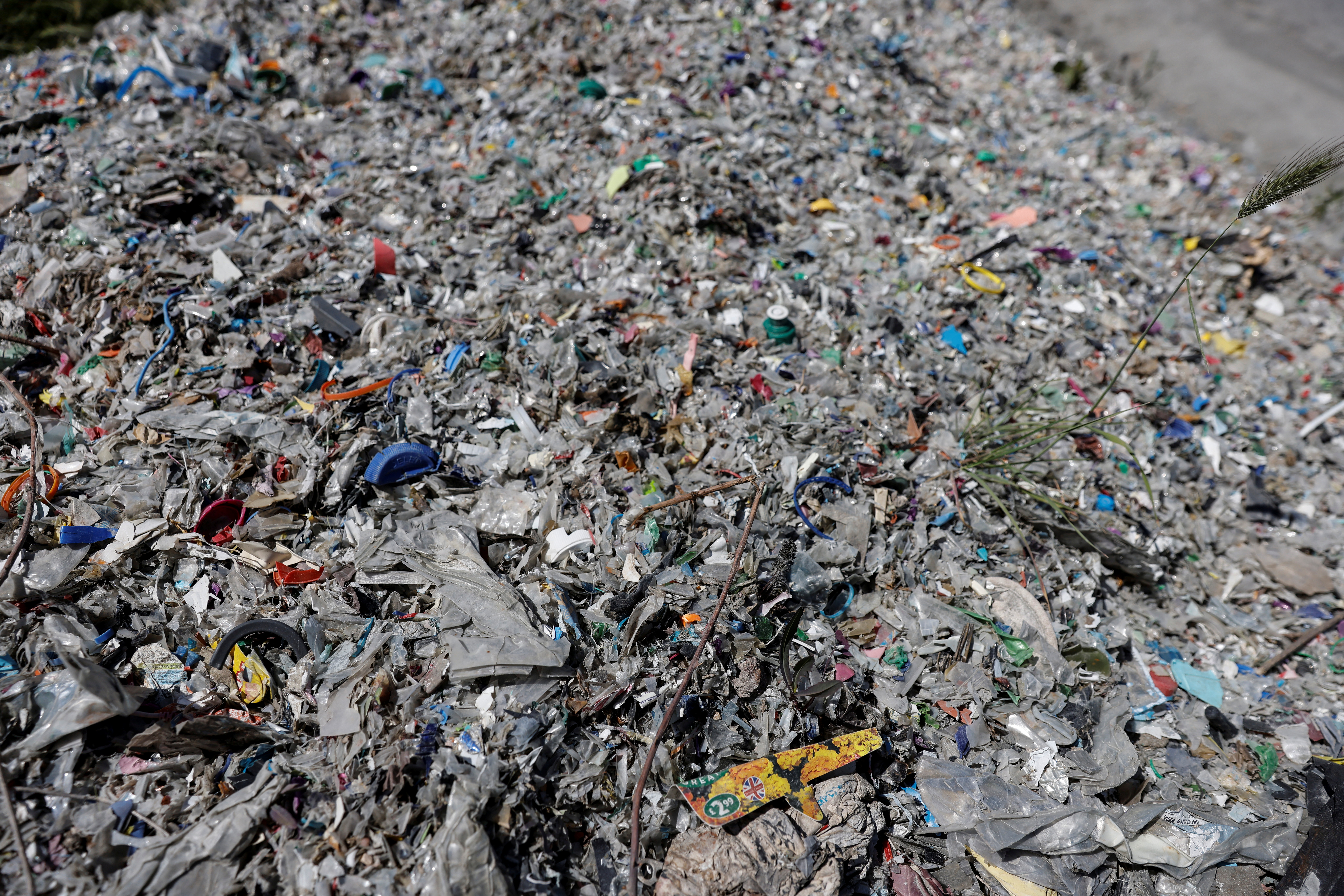 Plastic waste illegally dumped by a road side is seen near Alibeykoy Dam in Istanbul