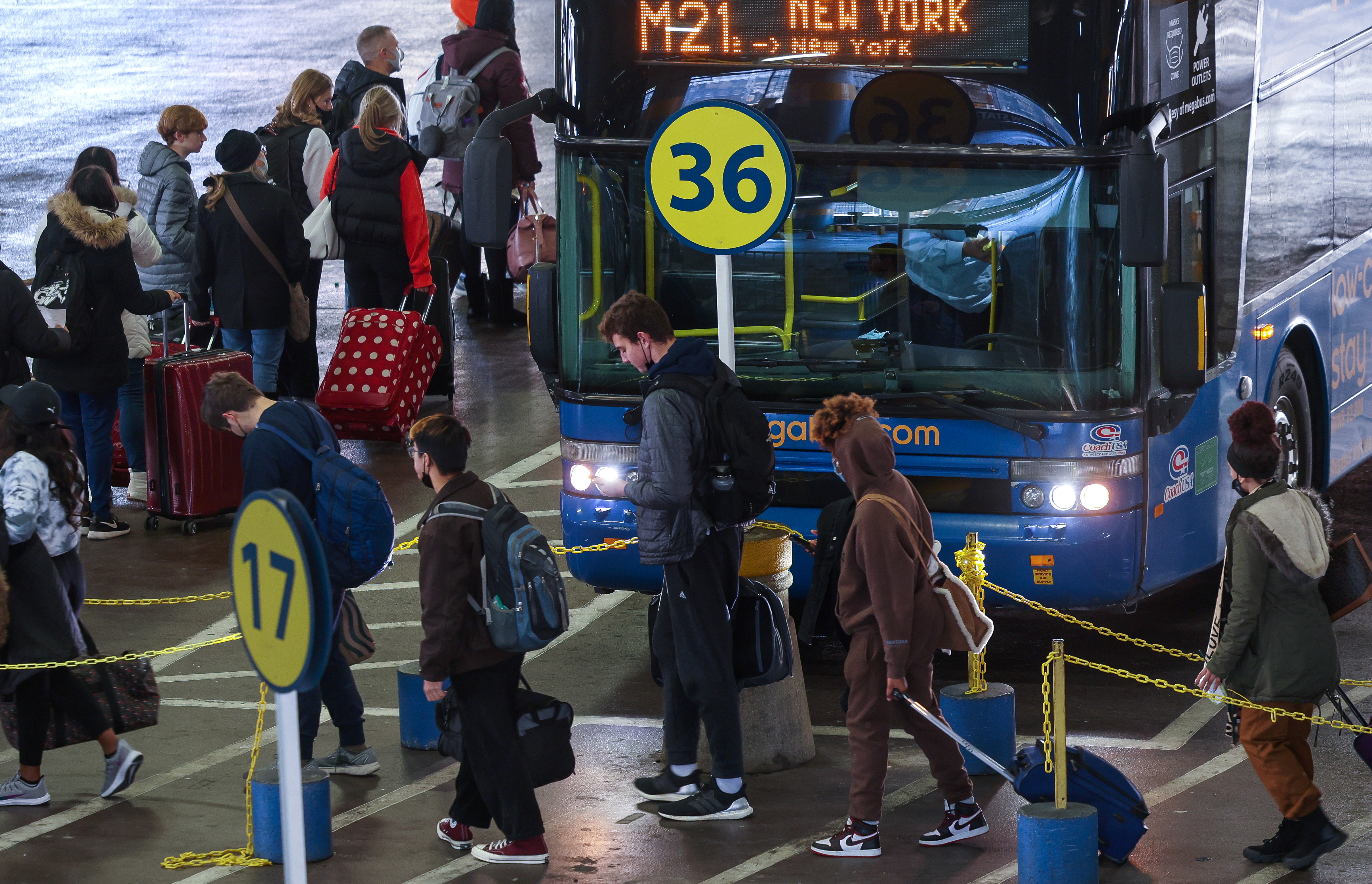 Travellers board buses at Union Station ahead of the Thanksgiving holiday in Washington