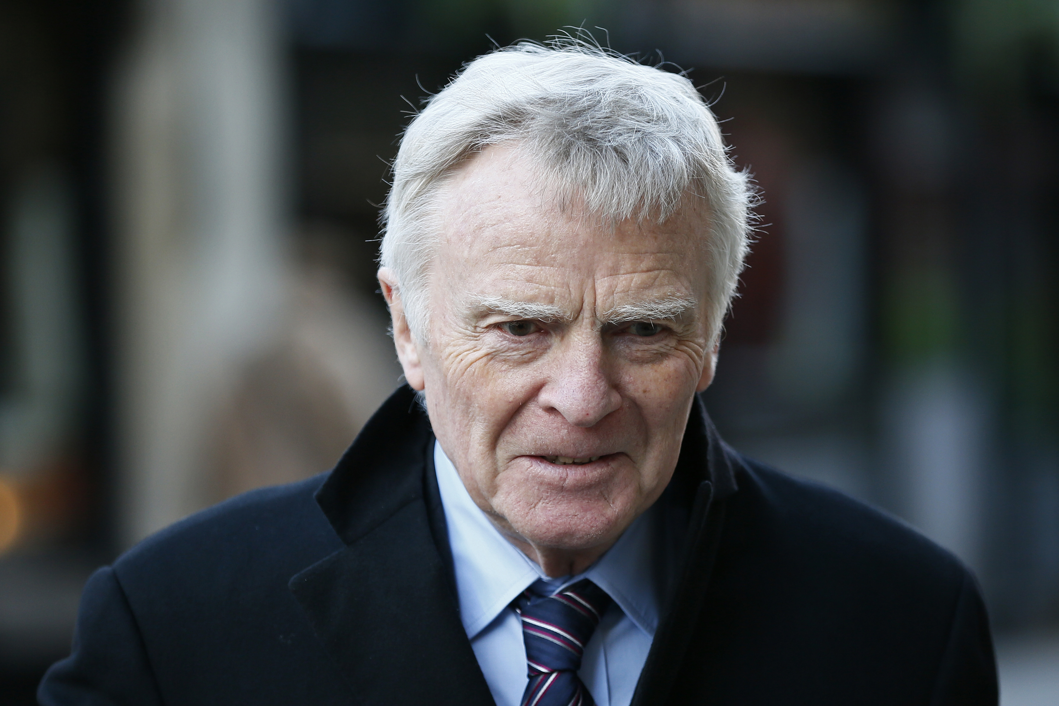 Former FIA racing chief Max Mosley leaves the High Court in London