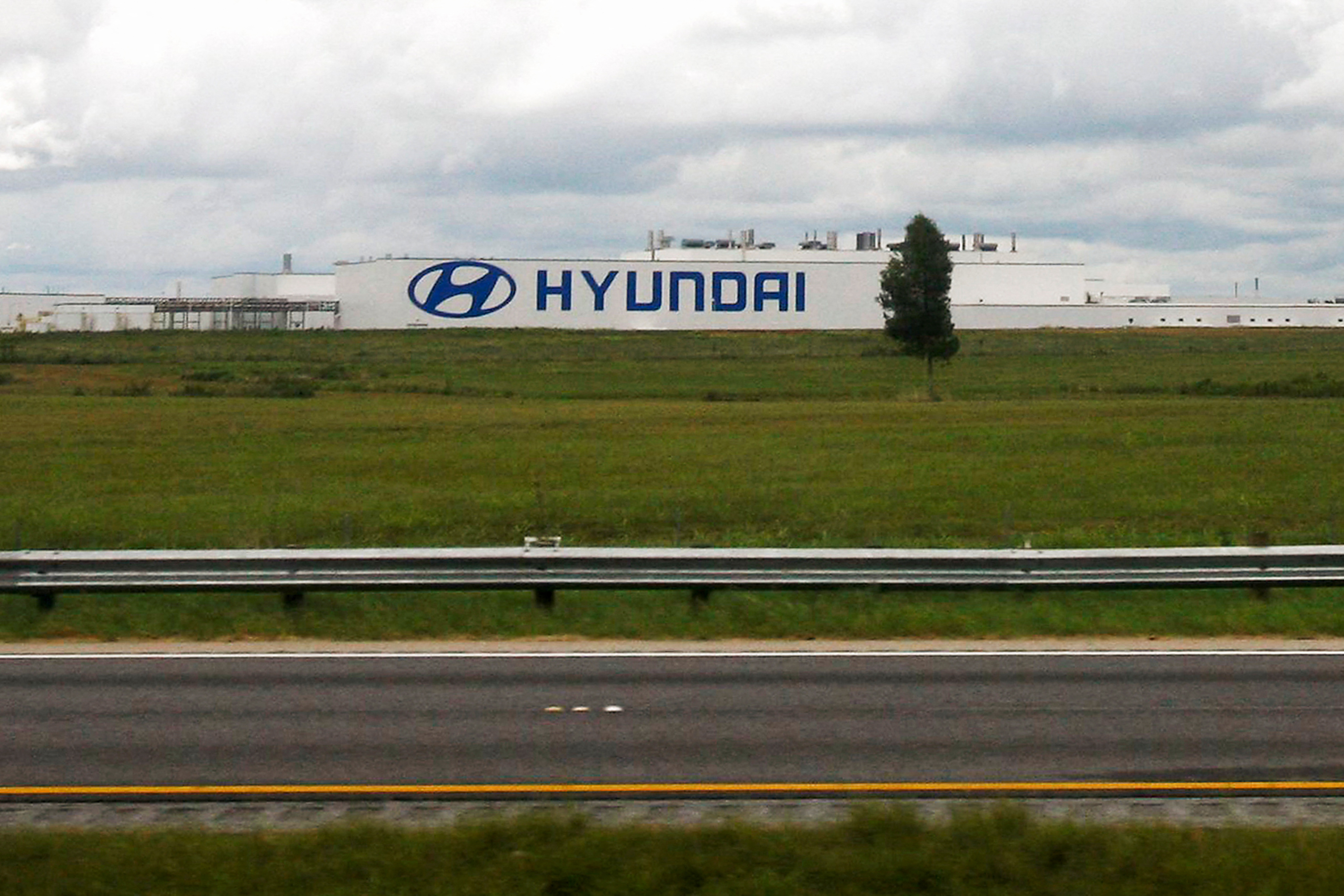 A Hyundai auto plant is seen from inside a Greyhound bus outside of Montgomery