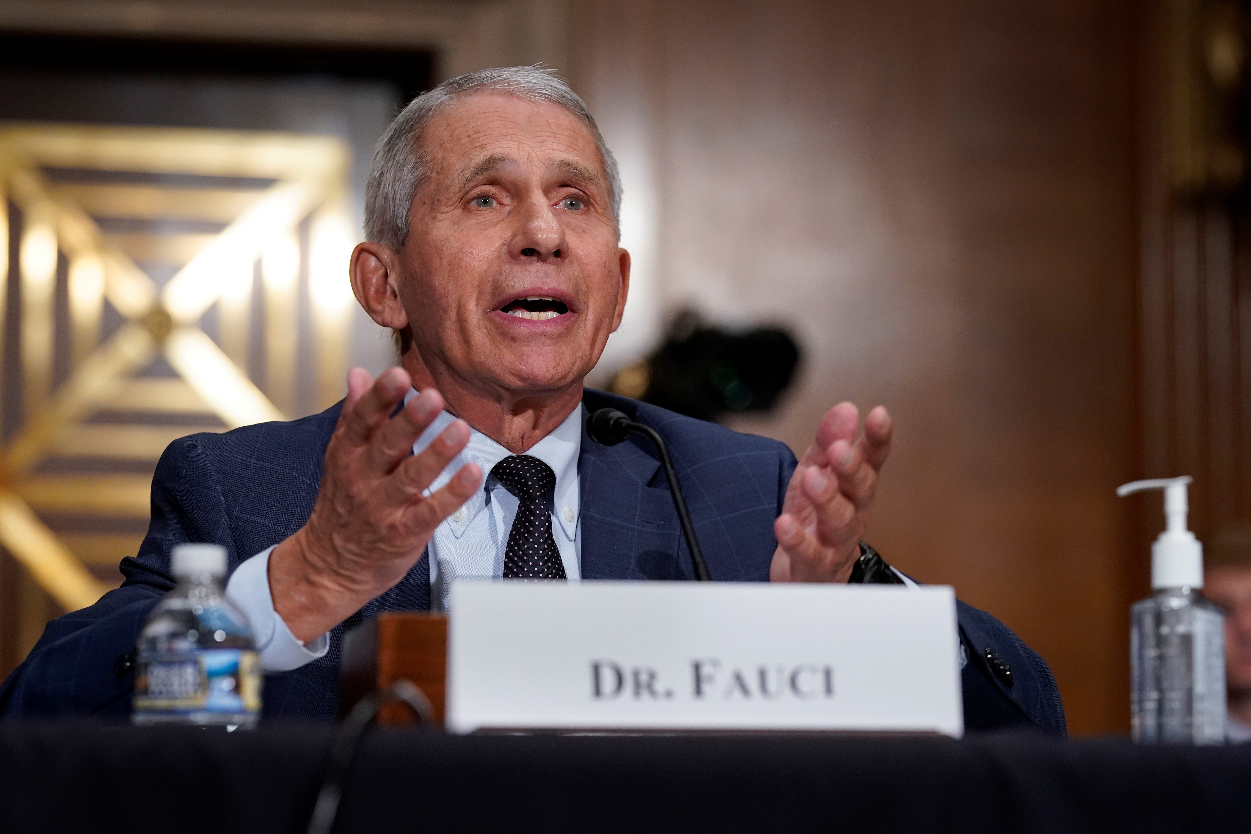Top infectious disease expert Dr. Anthony Fauci responds to accusations by Sen. Rand Paul (R-KY) as he testifies before the Senate Health, Education, Labor, and Pensions Committee on Capitol hill in Washington, D.C., U.S., July 20, 2021.  J. Scott Applewhite/Pool via REUTERS