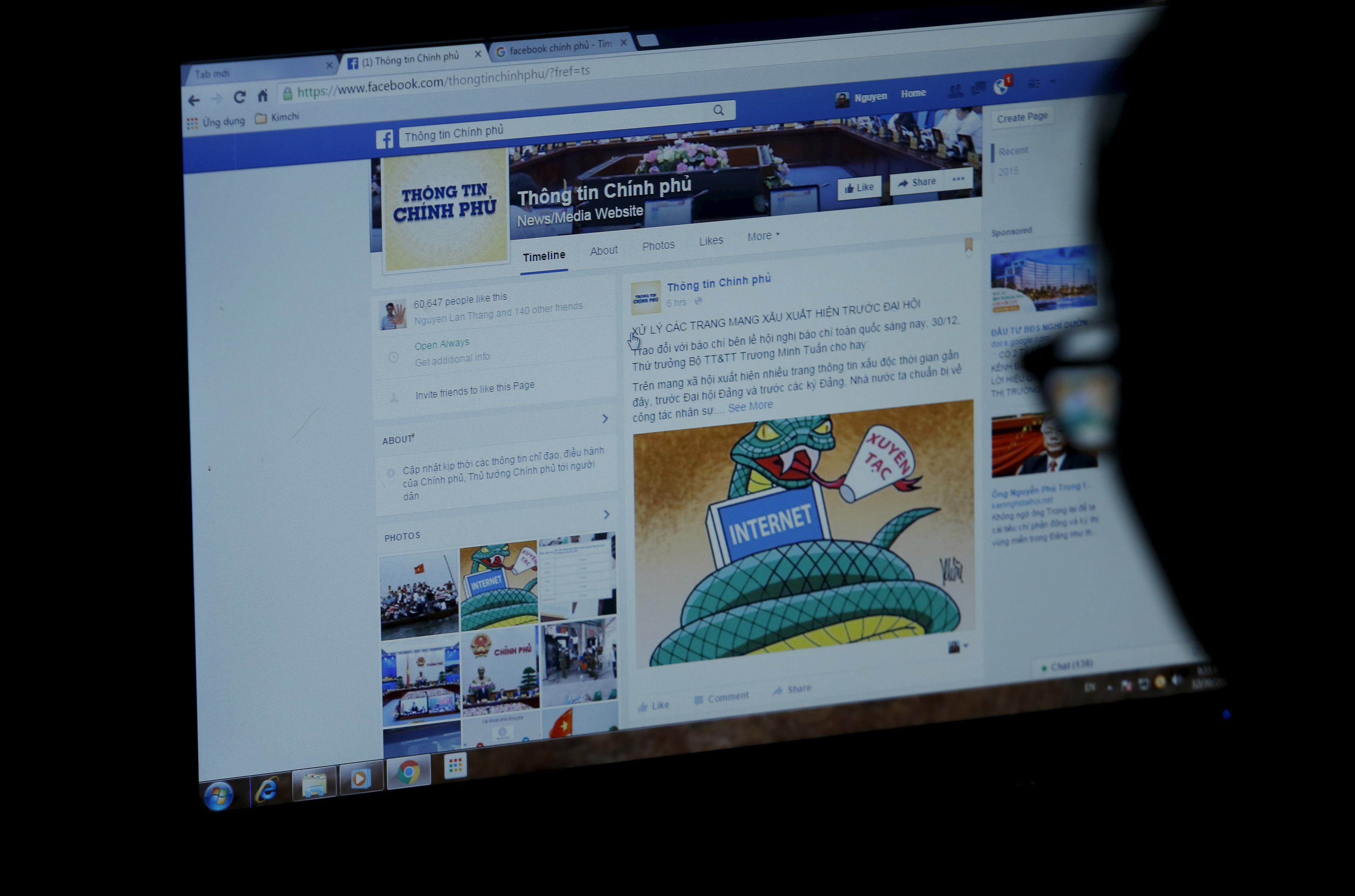 An internet user browses through the Vietnamese government's new Facebook page in Hanoi