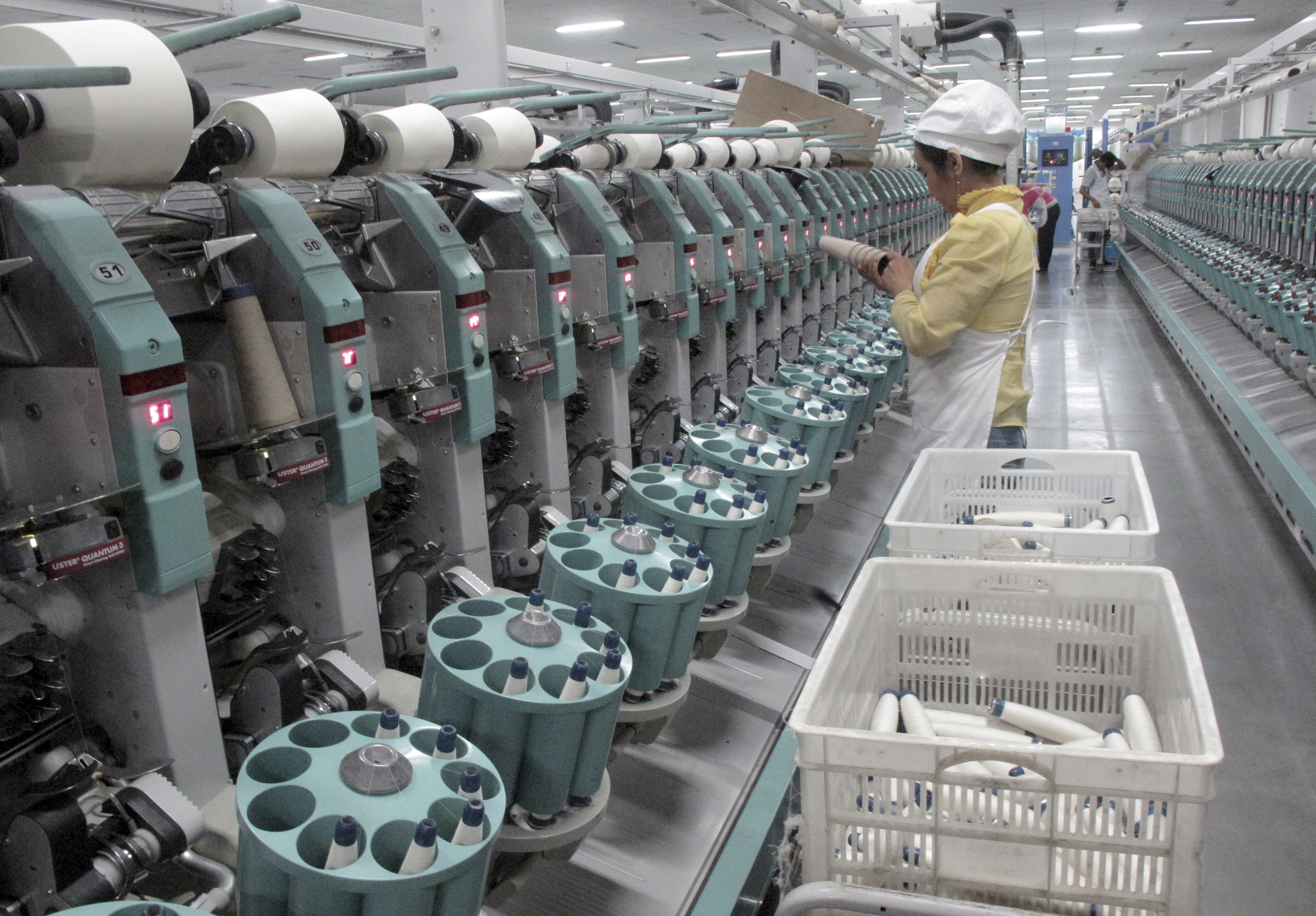A worker is seen in Youngor's cotton spinning factory, in Aksu, Xinjiang Uighur Autonomous Region