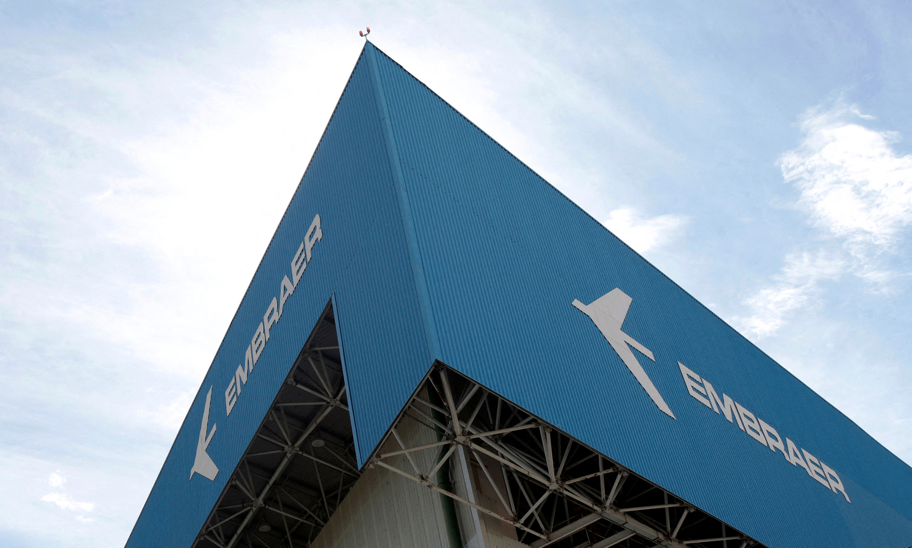 The logo of Brazilian jets maker Embraer is seen on a factory in Sao Jose dos Campos