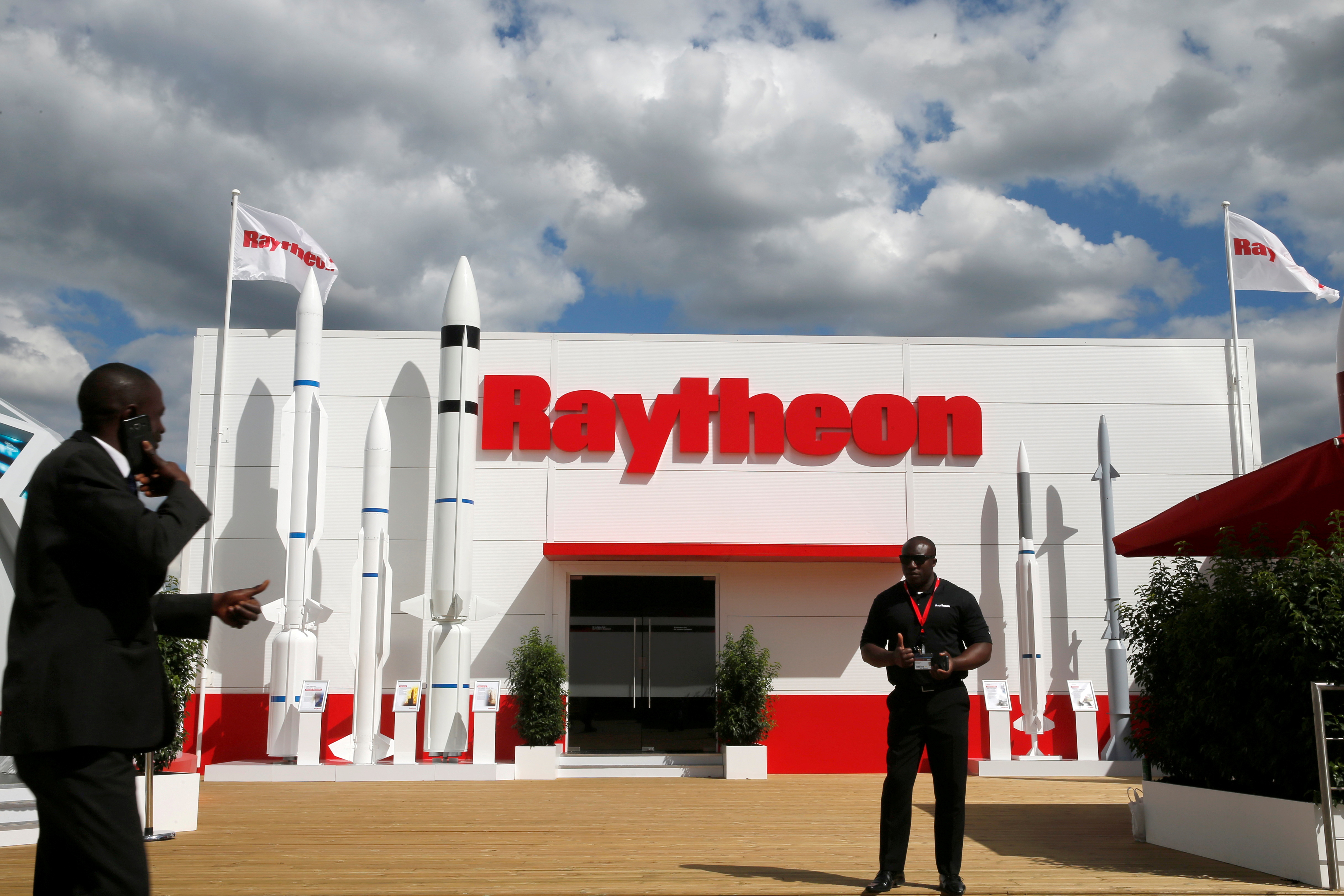 A security officer stands guard in front of a Raytheon stand at the 53rd International Paris Air Show at Le Bourget Airport near Paris