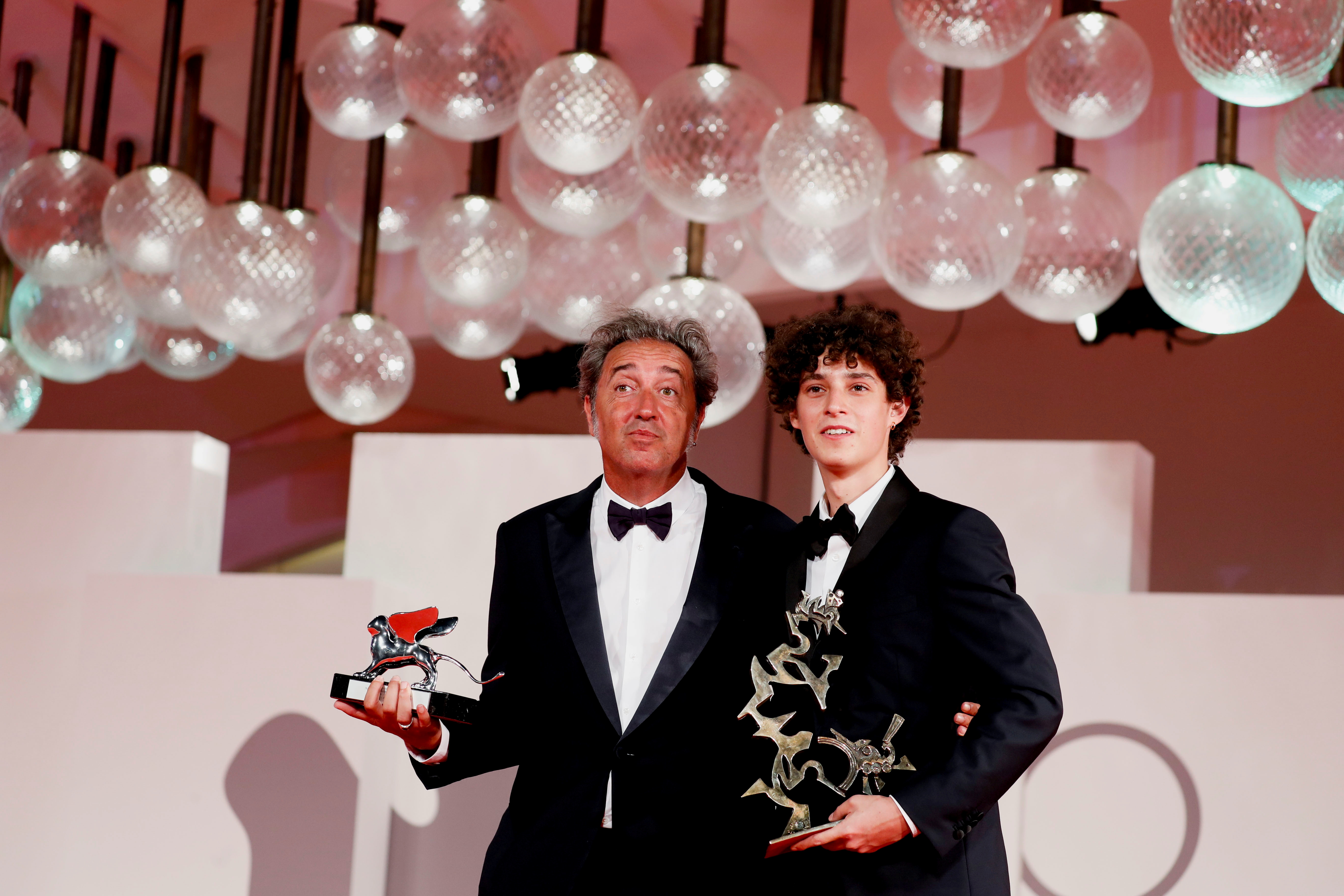 The 78th Venice Film Festival - Awards Ceremony - Venice, Italy, September 11, 2021 - Director Paolo Sorrentino and actor Filippo Scotti pose with their awards. REUTERS/Yara Nardi