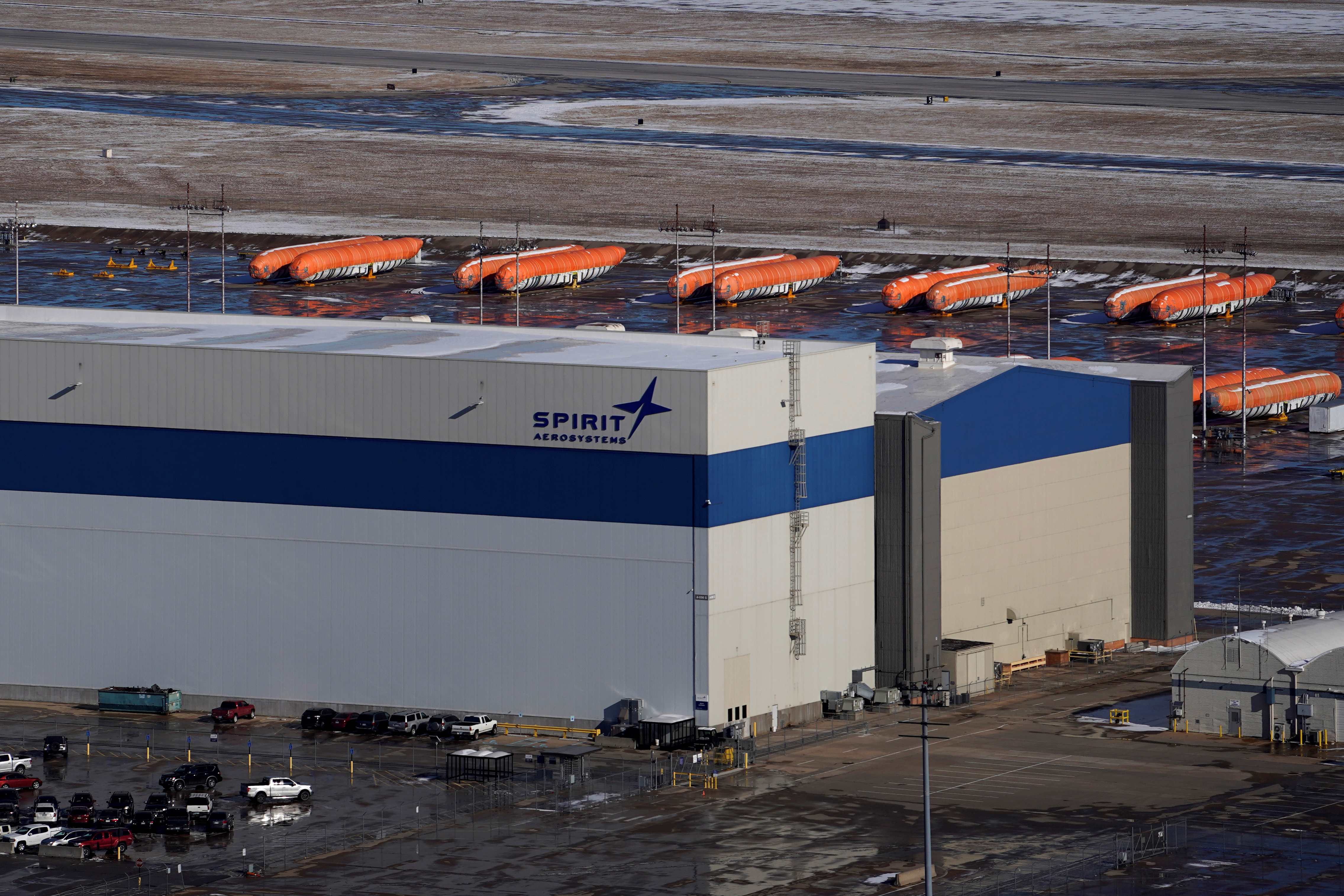 Airplane fuselages bound for Boeing's 737 Max production facility sit in storage behind Spirit AeroSystems Holdings Inc headquarters, in Wichita