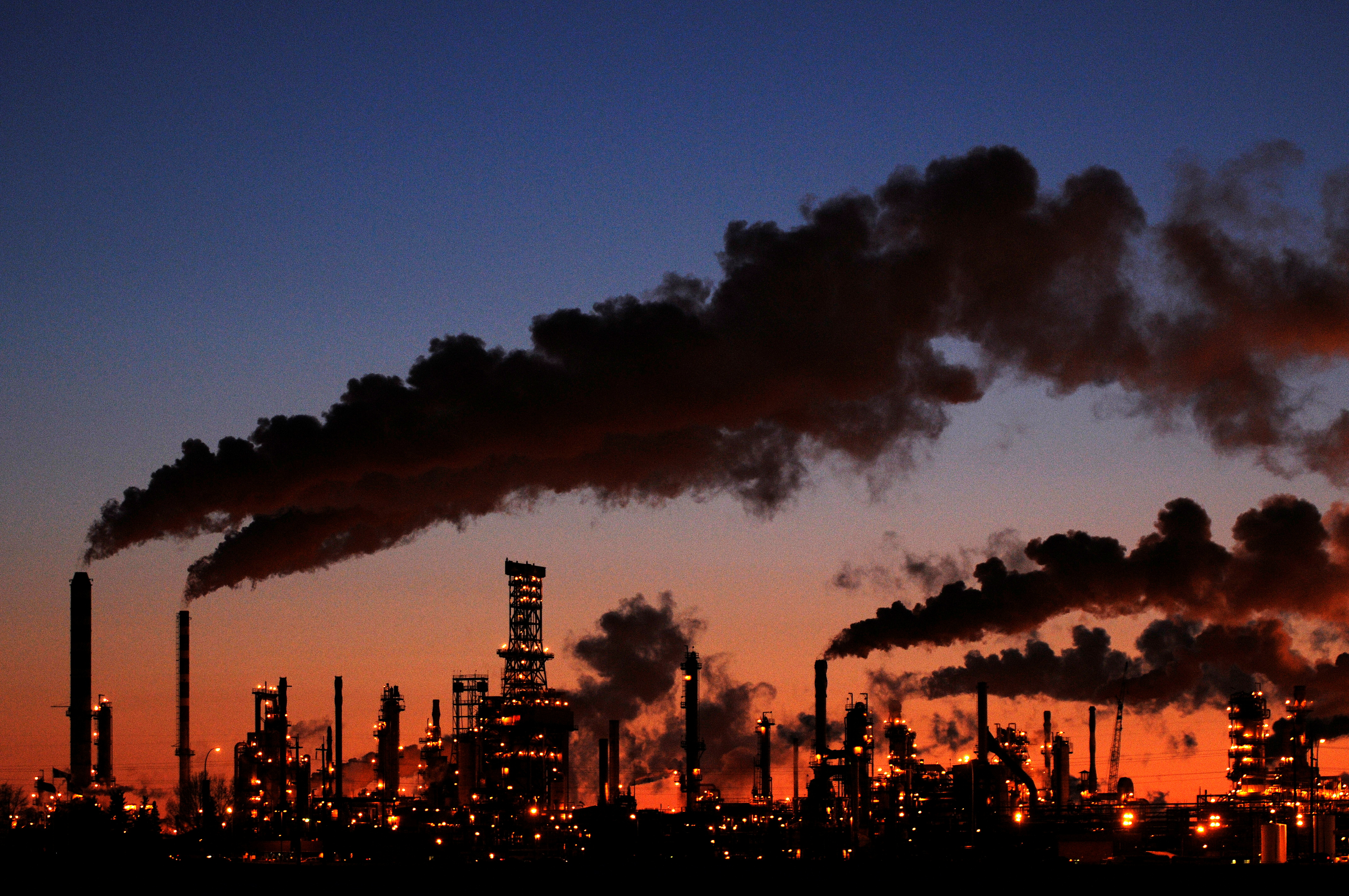 Petro-Canada's oil refinery glows at dusk in Edmonton