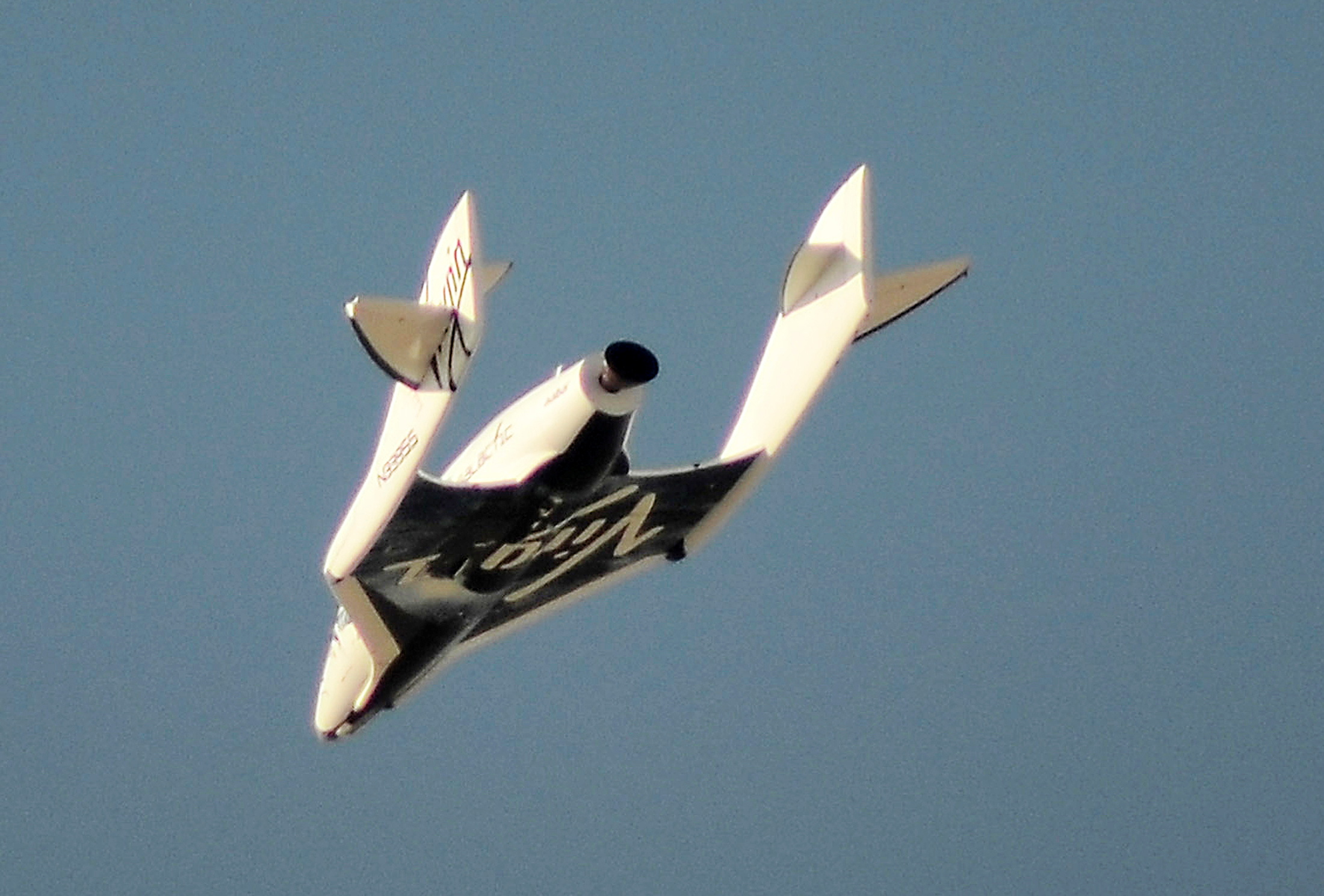 File photo of Virgin Galactic's SpaceShipTwo flies over the Mojave Desert shortly before successfully completing a test flight that broke the sound barrier