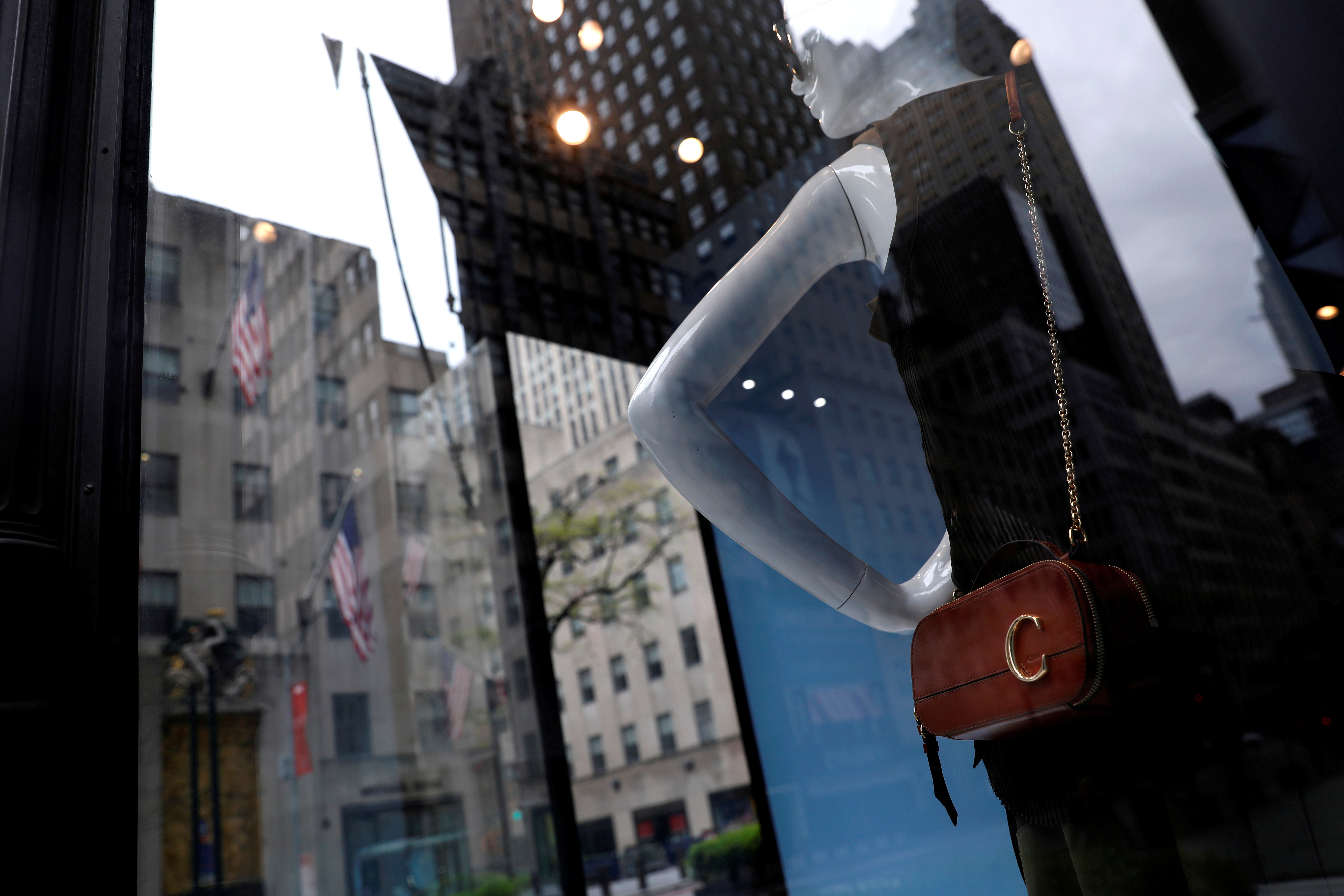 Luxury goods stores battle internet for Louis Vuitton, Gucci shoppers