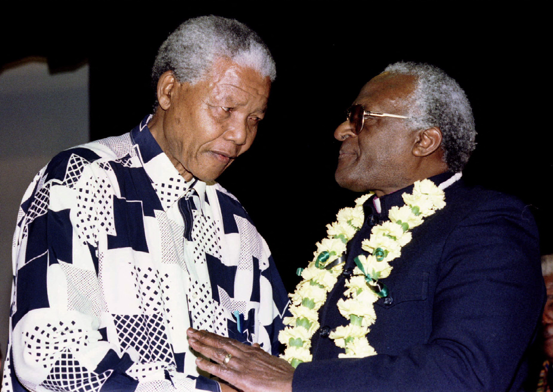 South African President Nelson Mandela shares a moment with Anglican Archbishop Desmond Tutu ahead of the 10th Desmond Tutu Peace Lecture August 6