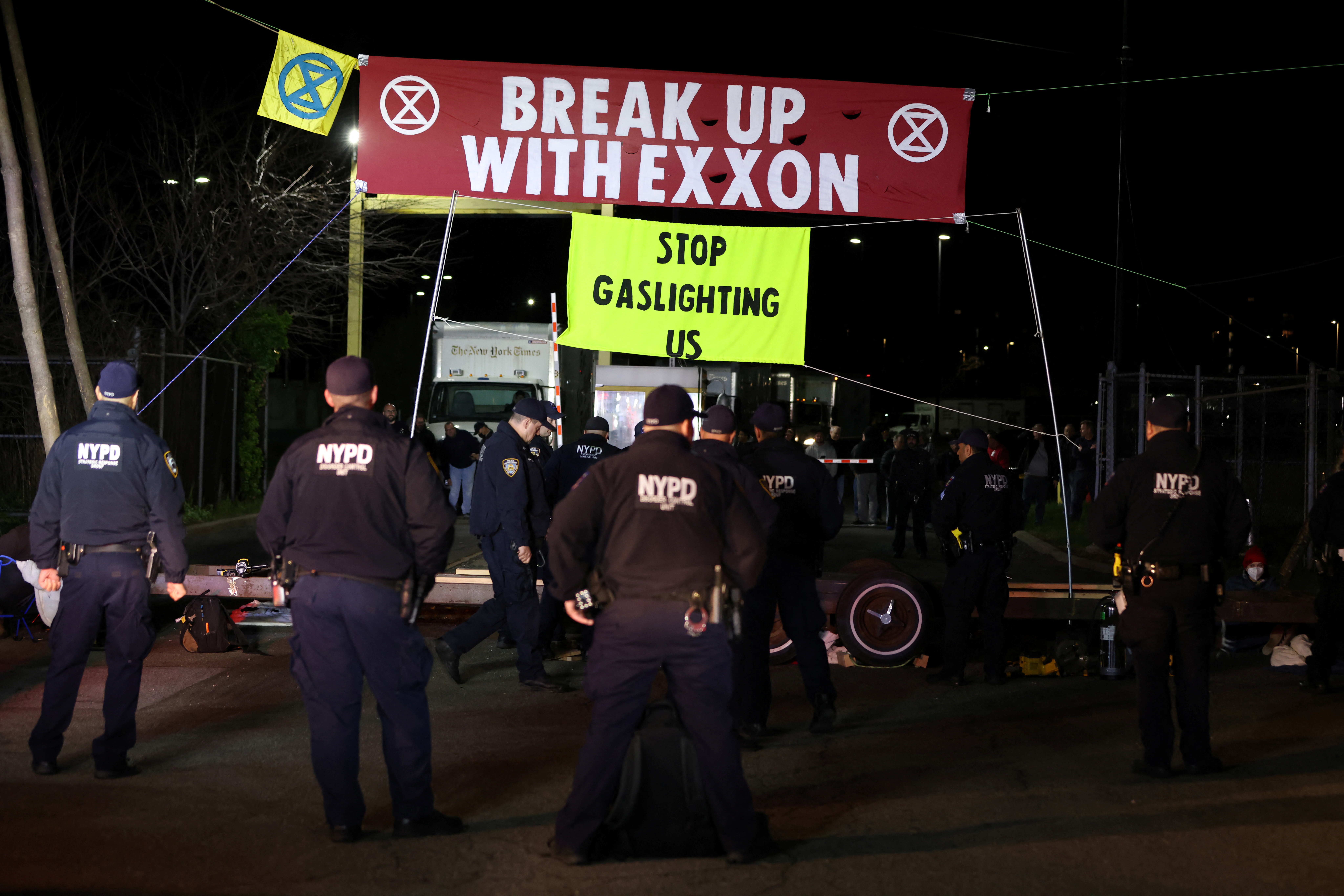 Extinction Rebellion activists take part in an Earth Day demonstration blockading the New York Times Distribution print facility in New York City