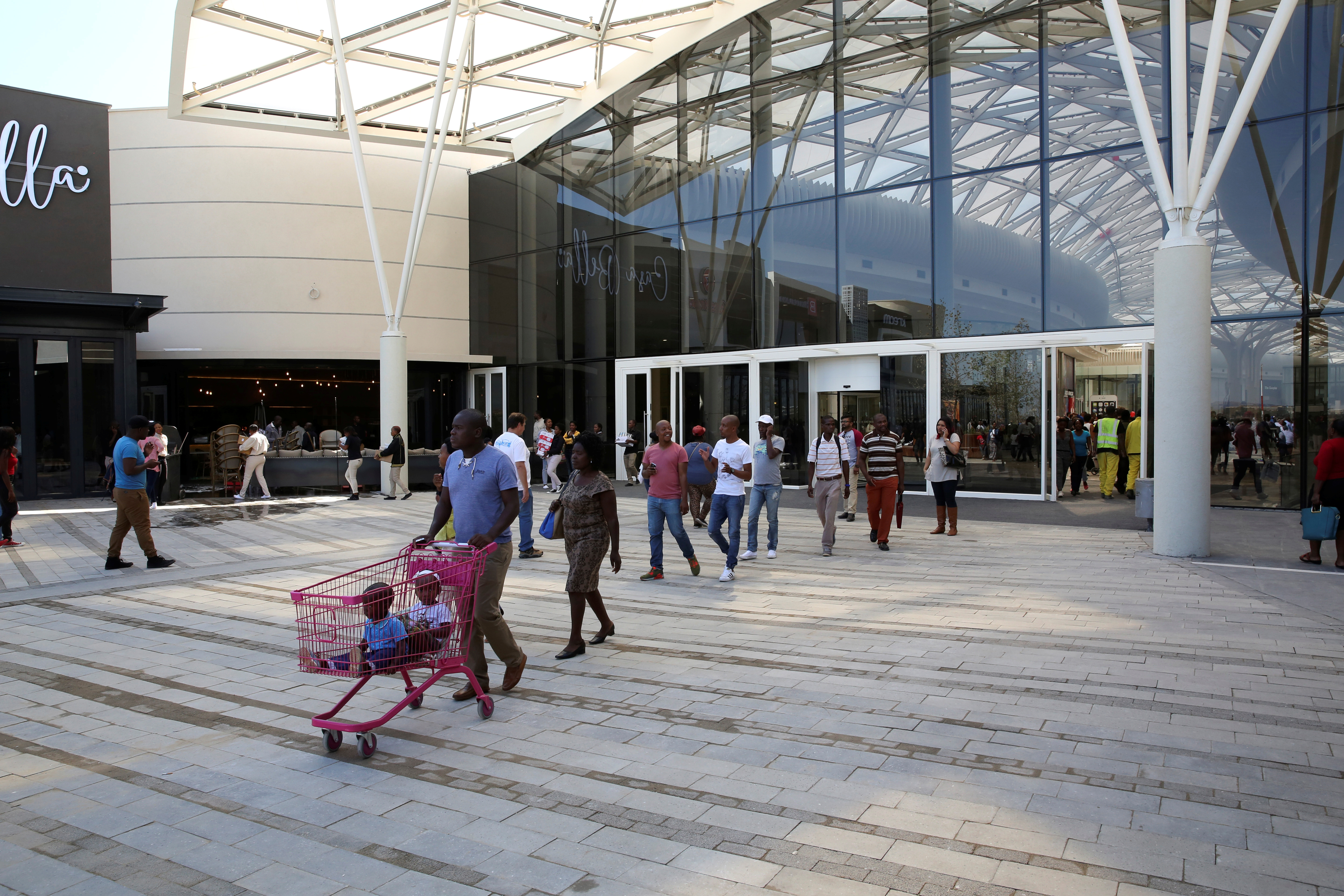 Shoppers walk during the opening of the 'Mall of Africa' in Midrand outside Johannesburg