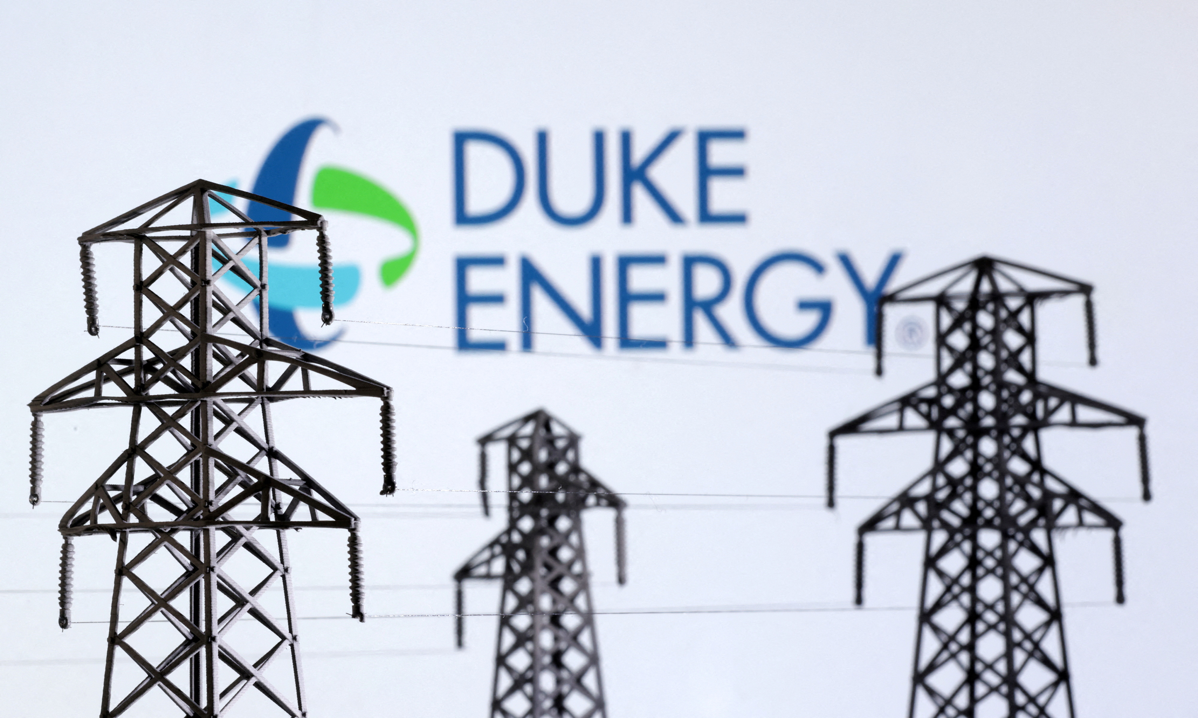 Illustration shows Electric power transmission pylon miniatures and Duke Energy logo