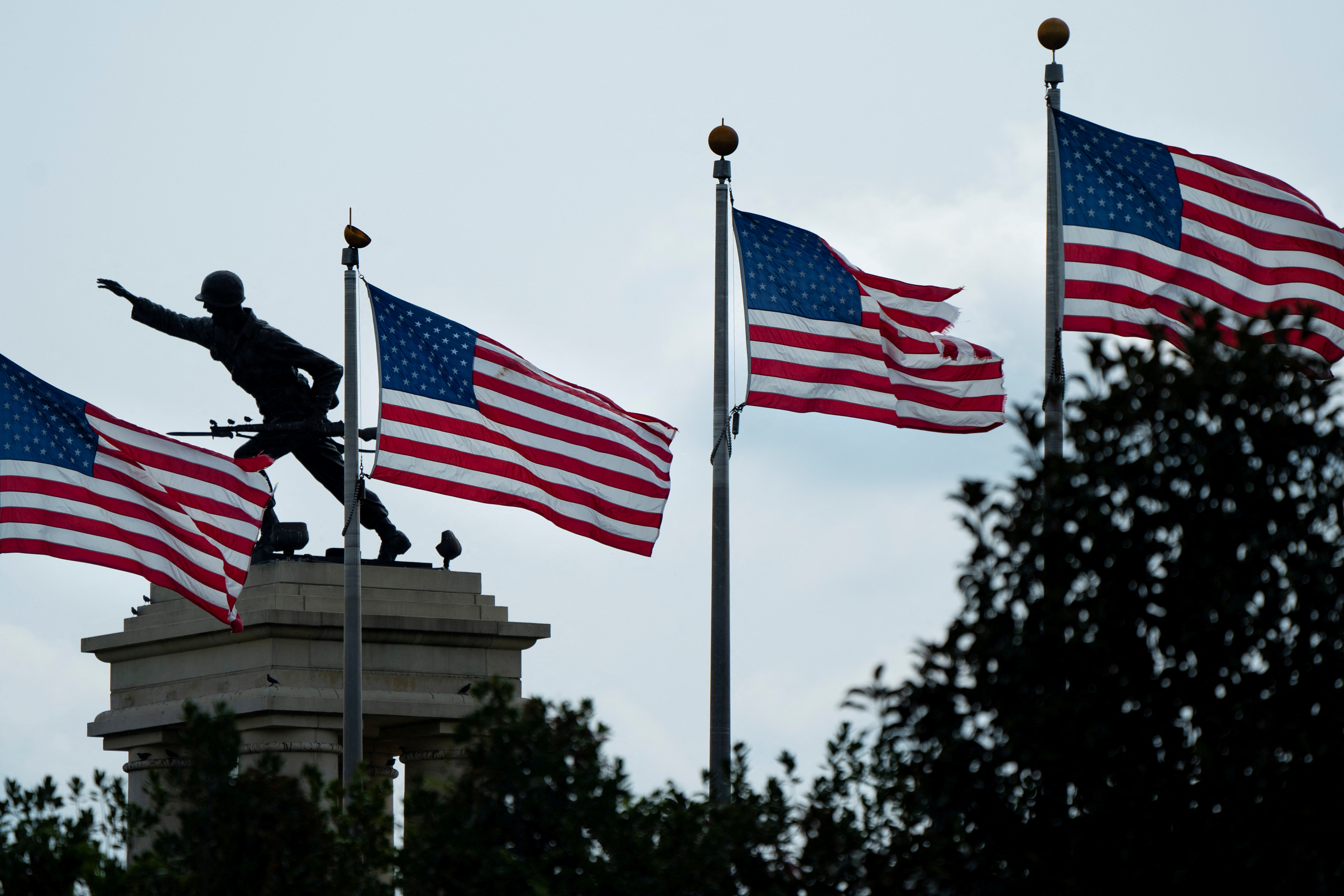 Flags and a monument are seen at the entrance to Fort Benning in Columbus