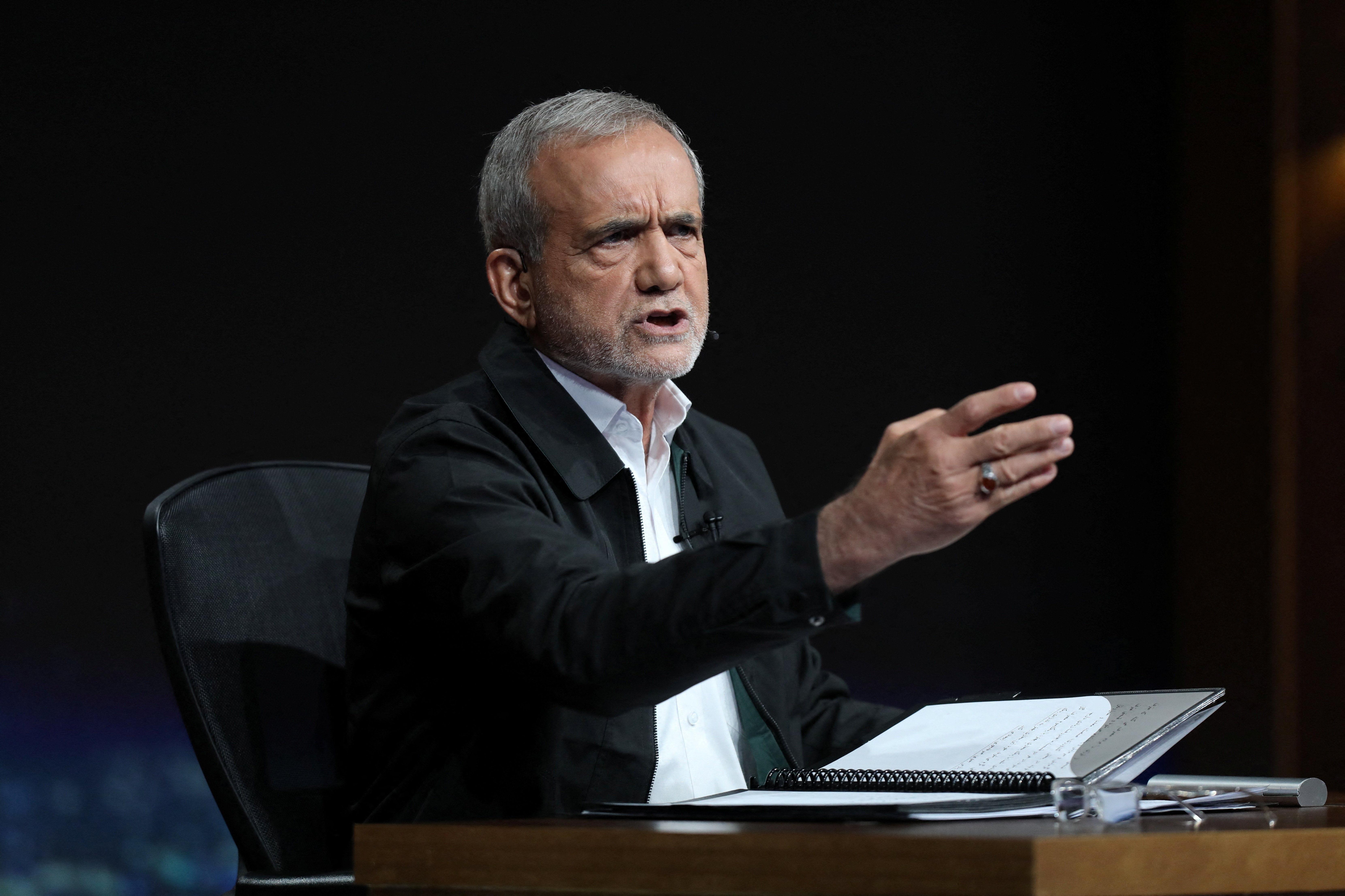 Presidential candidates Pezeshkian and Jalili ​attend an election debate in Tehran
