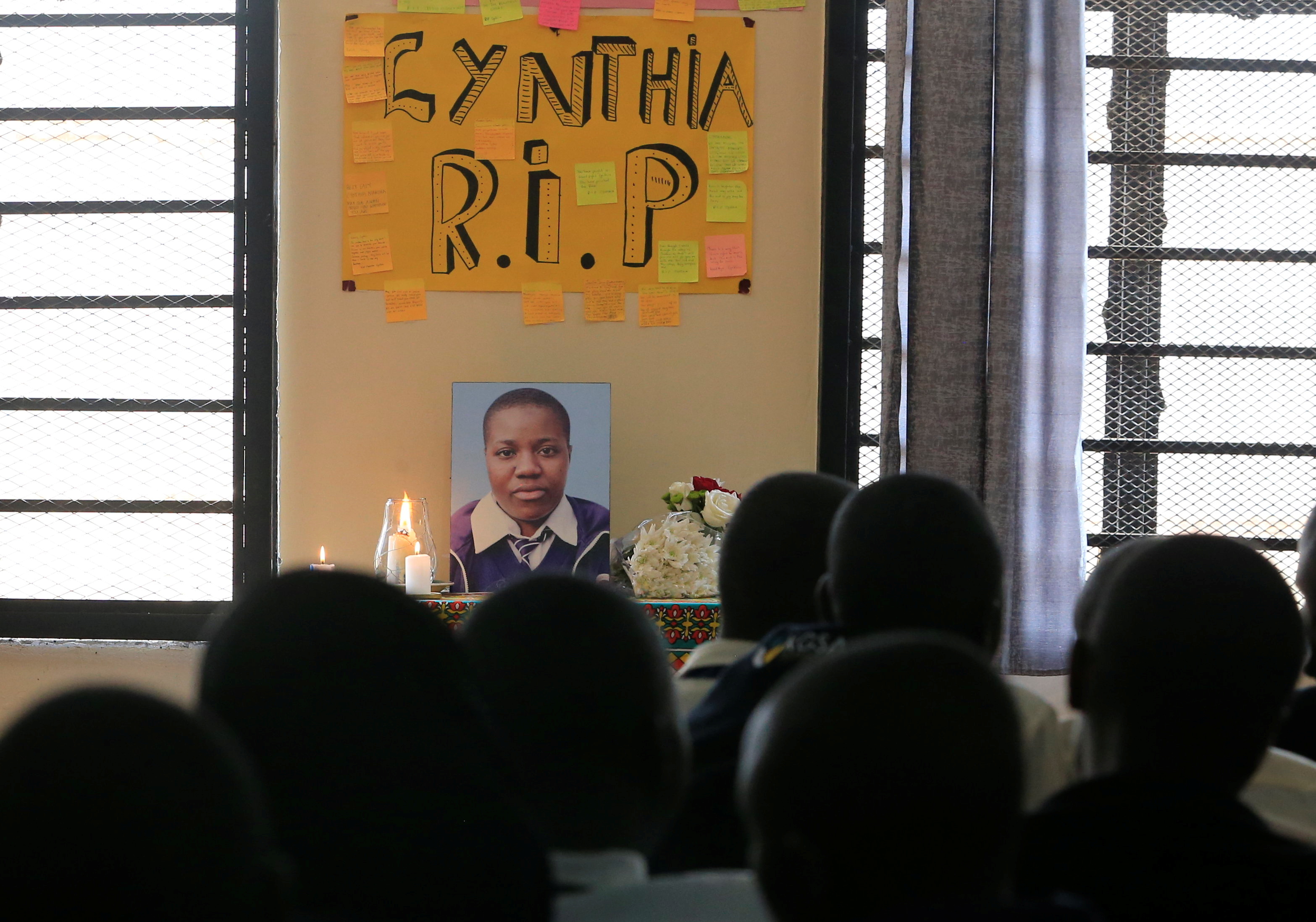 Students at the Kibera Girls School Soccer Academy (KGSA) attend a memorial service for Cynthia Makokha (on the photograph), a teenage student who was raped and killed as she travelled home for school holidays, in Kibera district of Nairobi, Kenya October 15, 2021. REUTERS/Thomas Mukoya