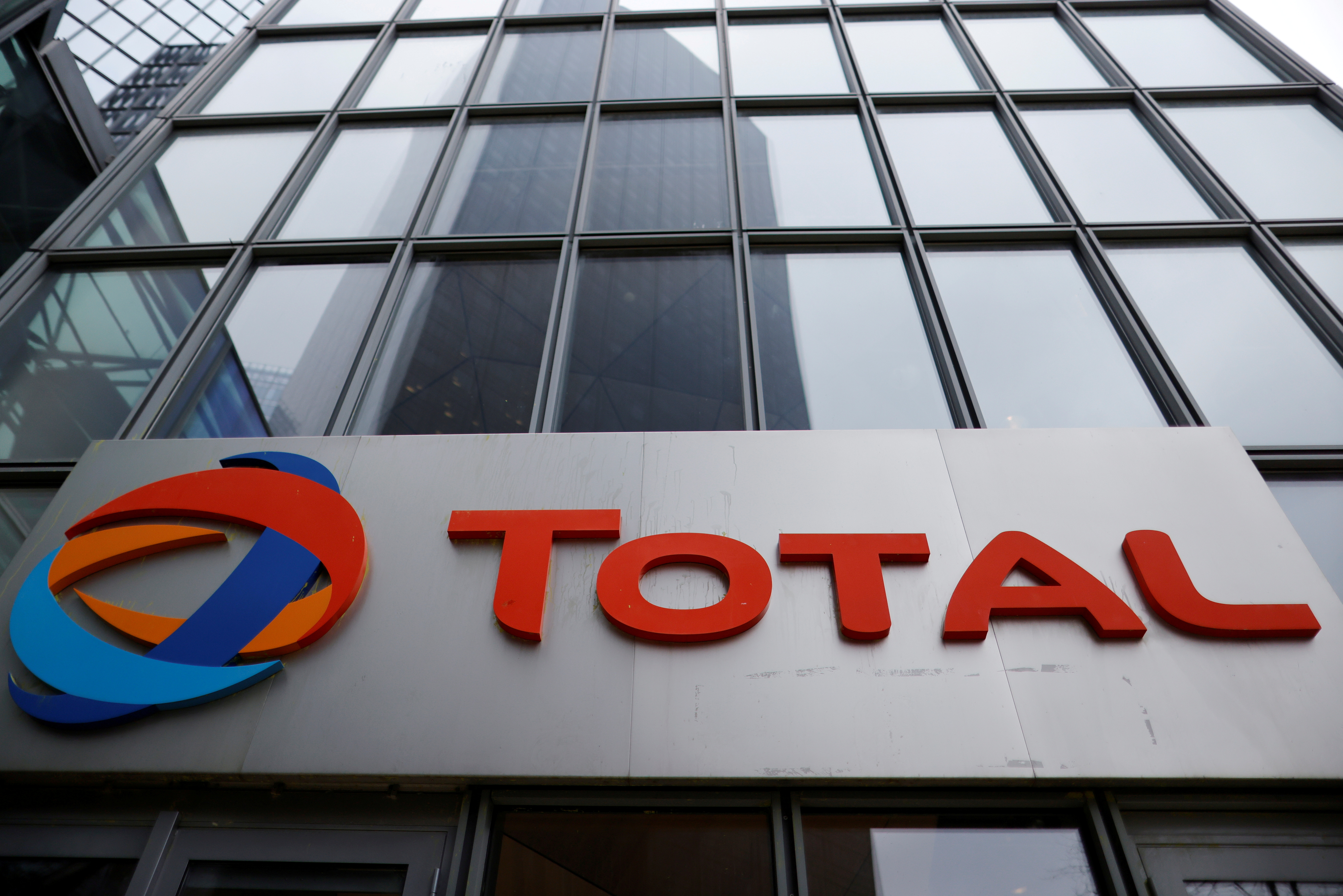 The logo of French oil and gas company Total is seen at La Defense business district in Courbevoie near Paris, France, February 8, 2021. REUTERS/Sarah Meyssonnier/File Photo
