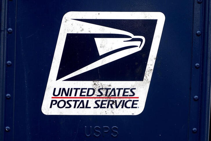 A U.S. Postal Service (USPS) logo is pictured on a mail box
