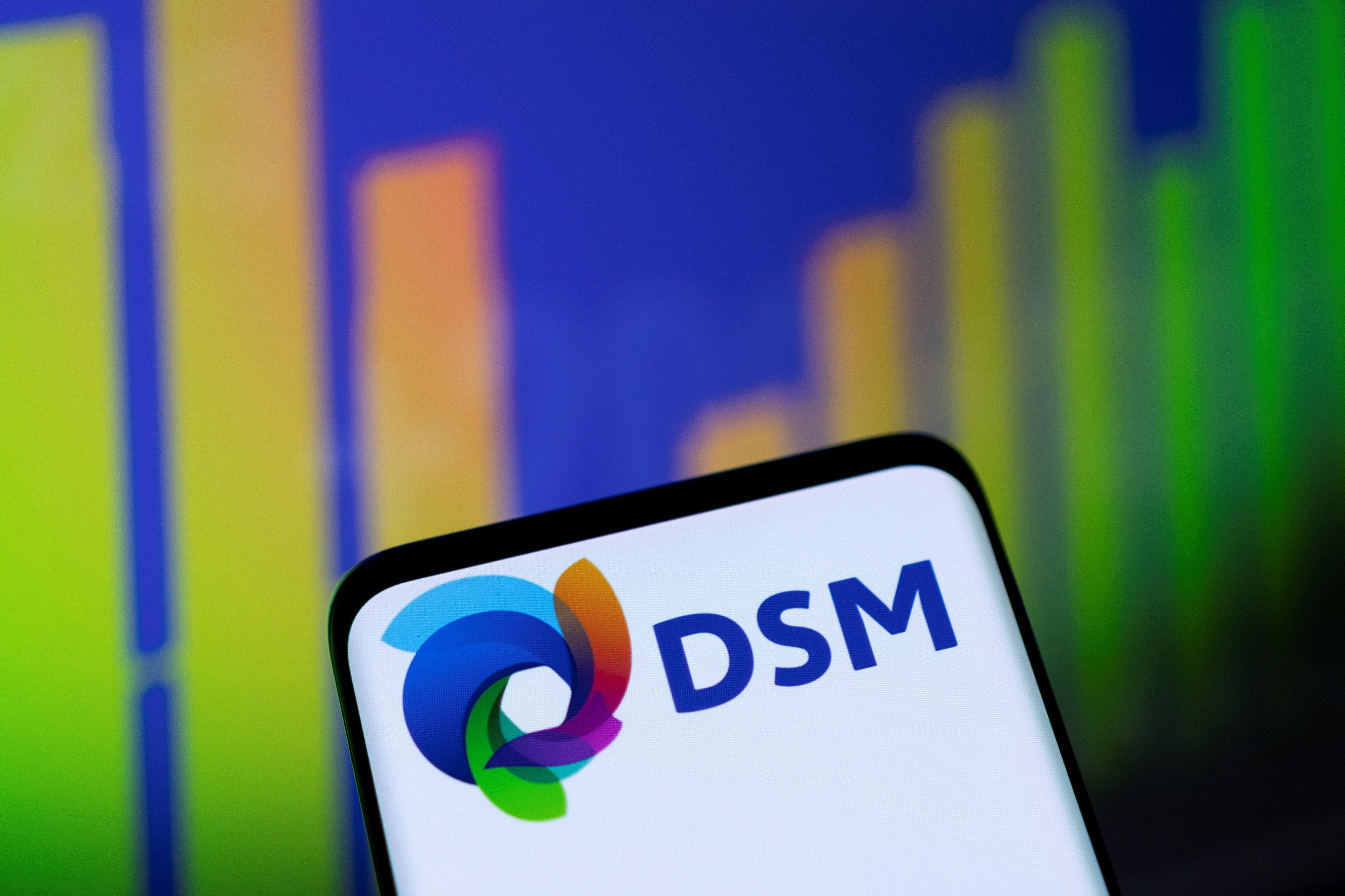 Illustration shows DSM logo and stock graph