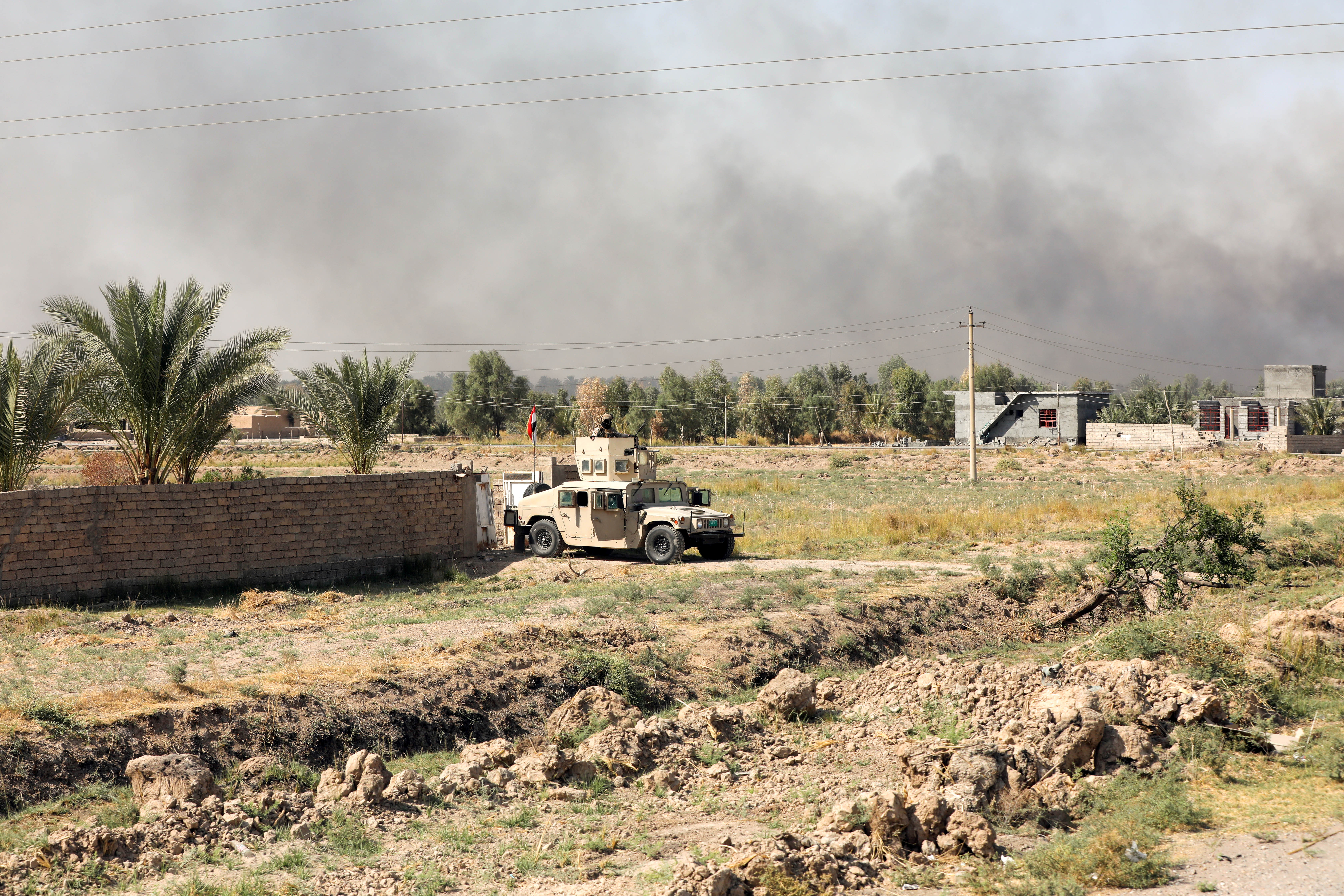 A member of Iraqi security forces is seen after an attack by Islamic State militants, near Muqdadiya
