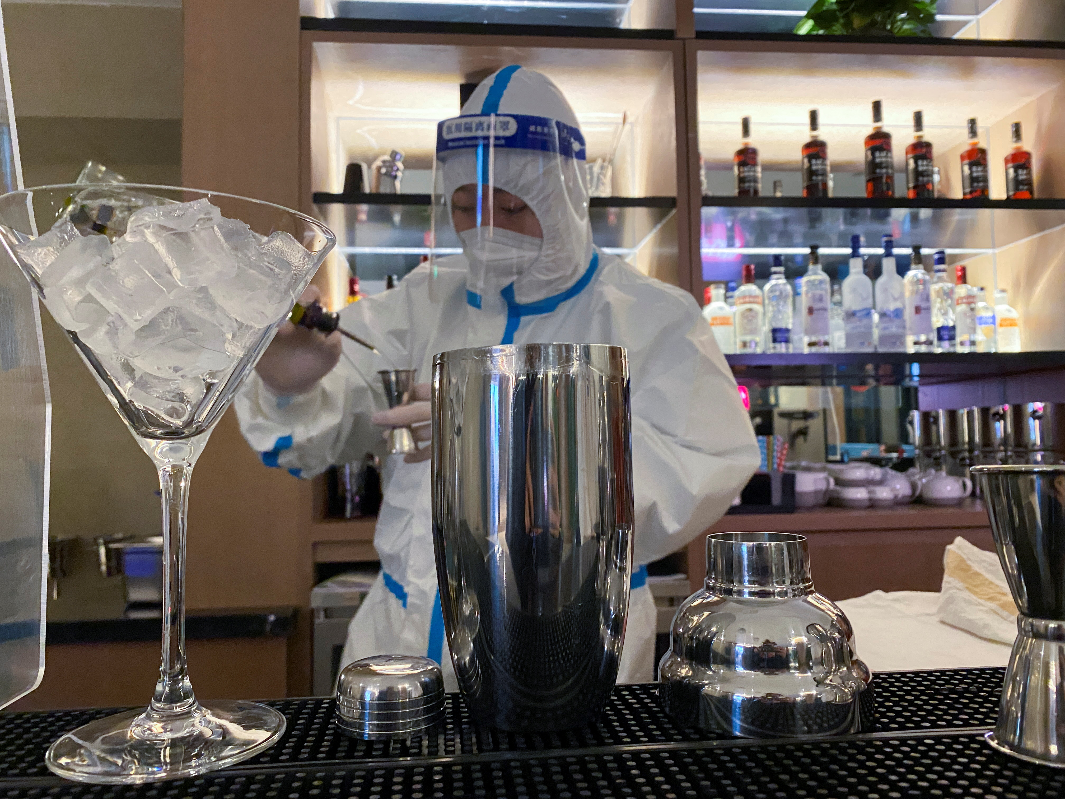 Cocktails and hazmat suits mingle in the Beijing Olympics bubble