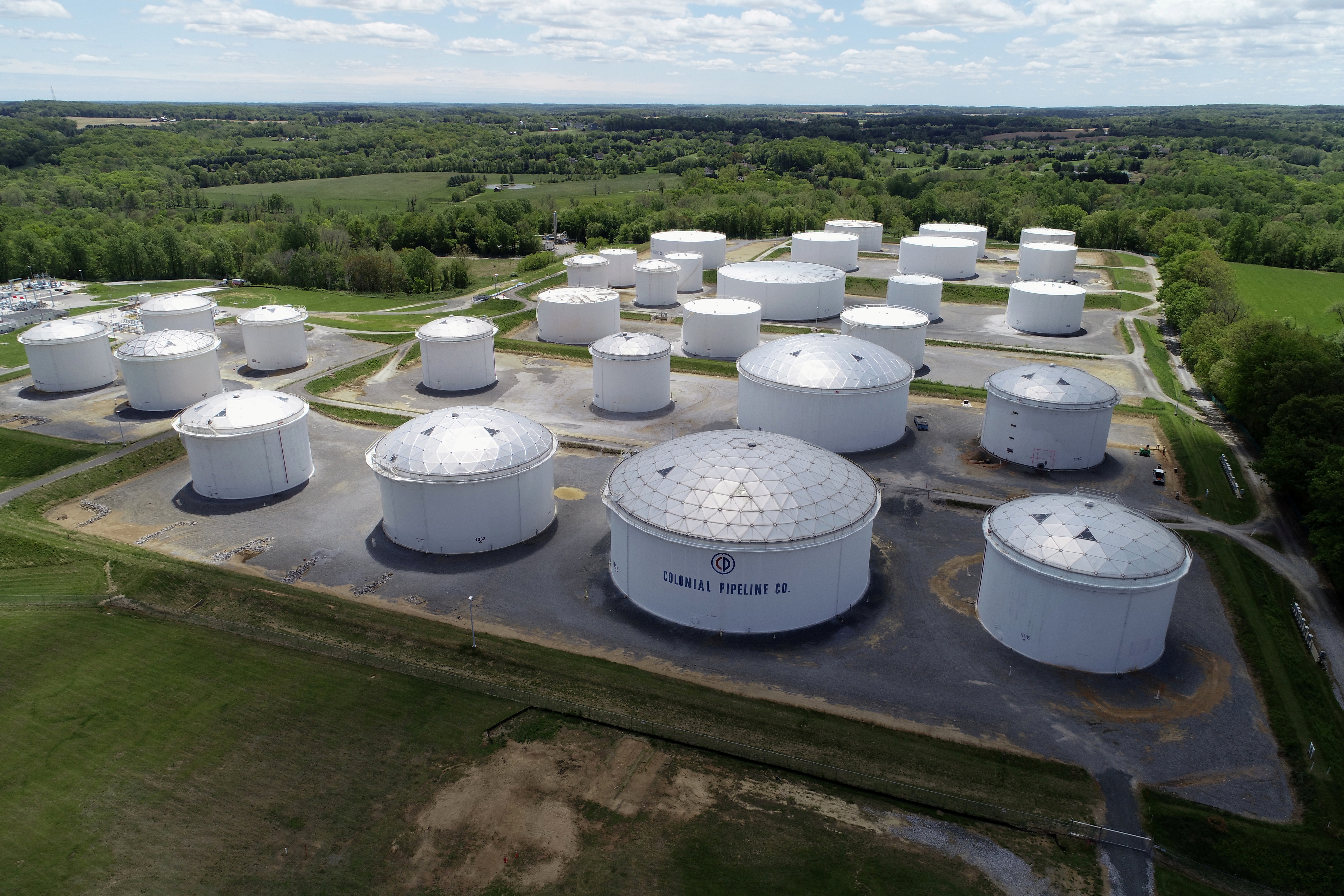 Holding tanks are seen in an aerial photograph at Colonial Pipeline's Dorsey Junction Station in Woodbine, Maryland, U.S. May 10, 2021. REUTERS/Drone Base