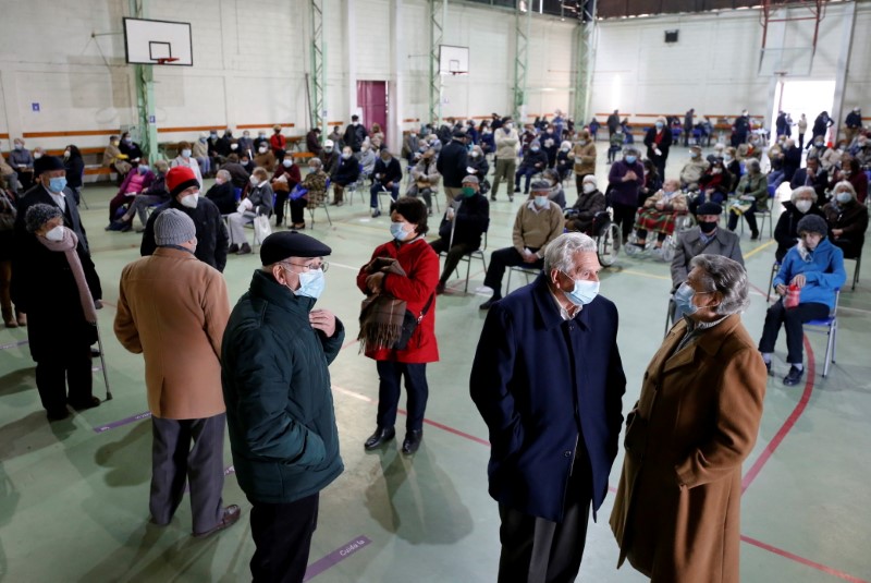 Elderly people wait to receive the Pfizer BioNTech or AstraZeneca coronavirus disease (COVID-19) vaccine as Chile starts a booster vaccination campaign for those inoculated with the Sinovac vaccine, in Valparaiso, Chile, August 11, 2021. REUTERS/Rodrigo Garrido