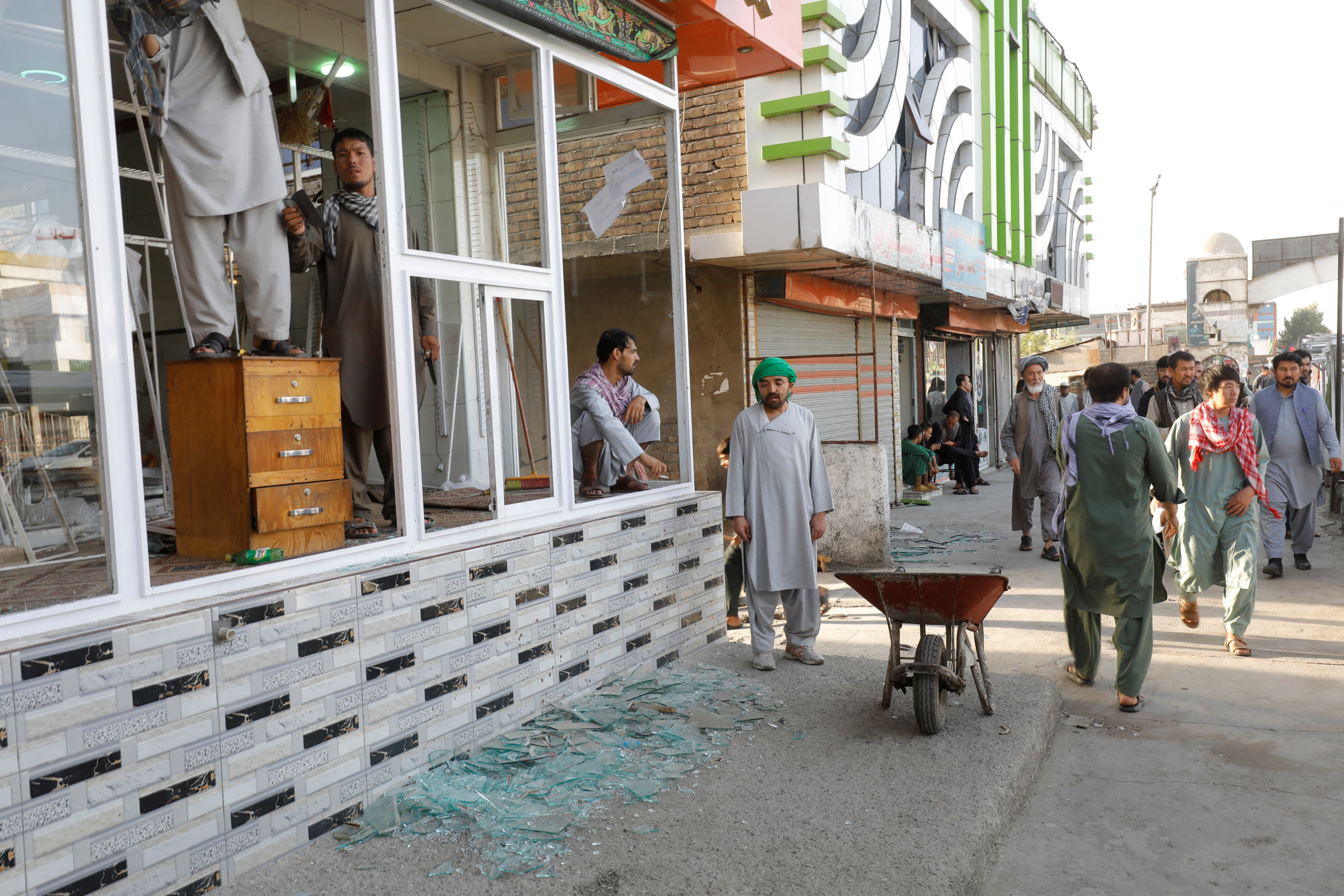 Broken glasses of a bakery near the site of a blast in Kabul