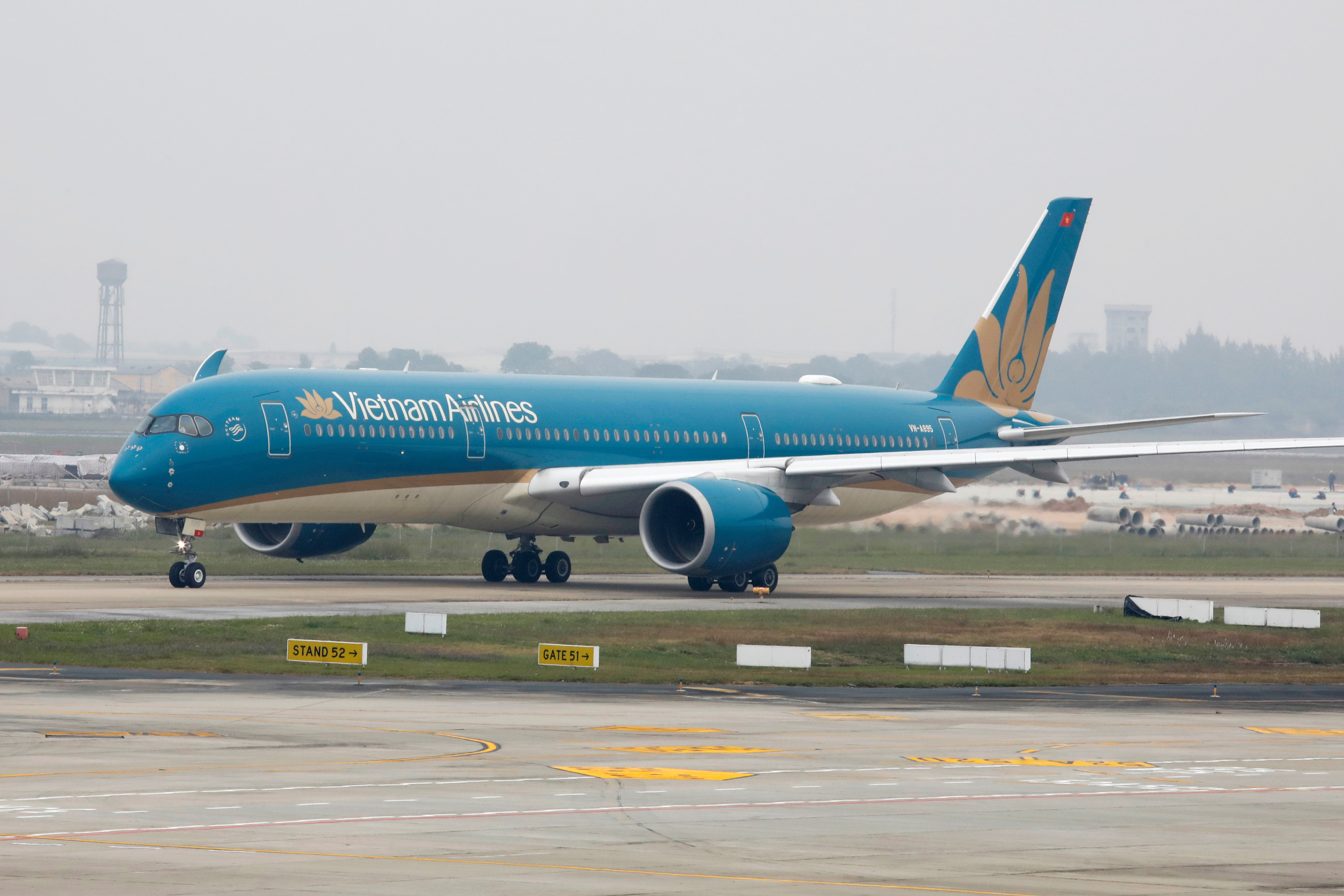 Aircraft of the national flag carrier Vietnam Airlines taxis at Noi Bai airport in Hanoi