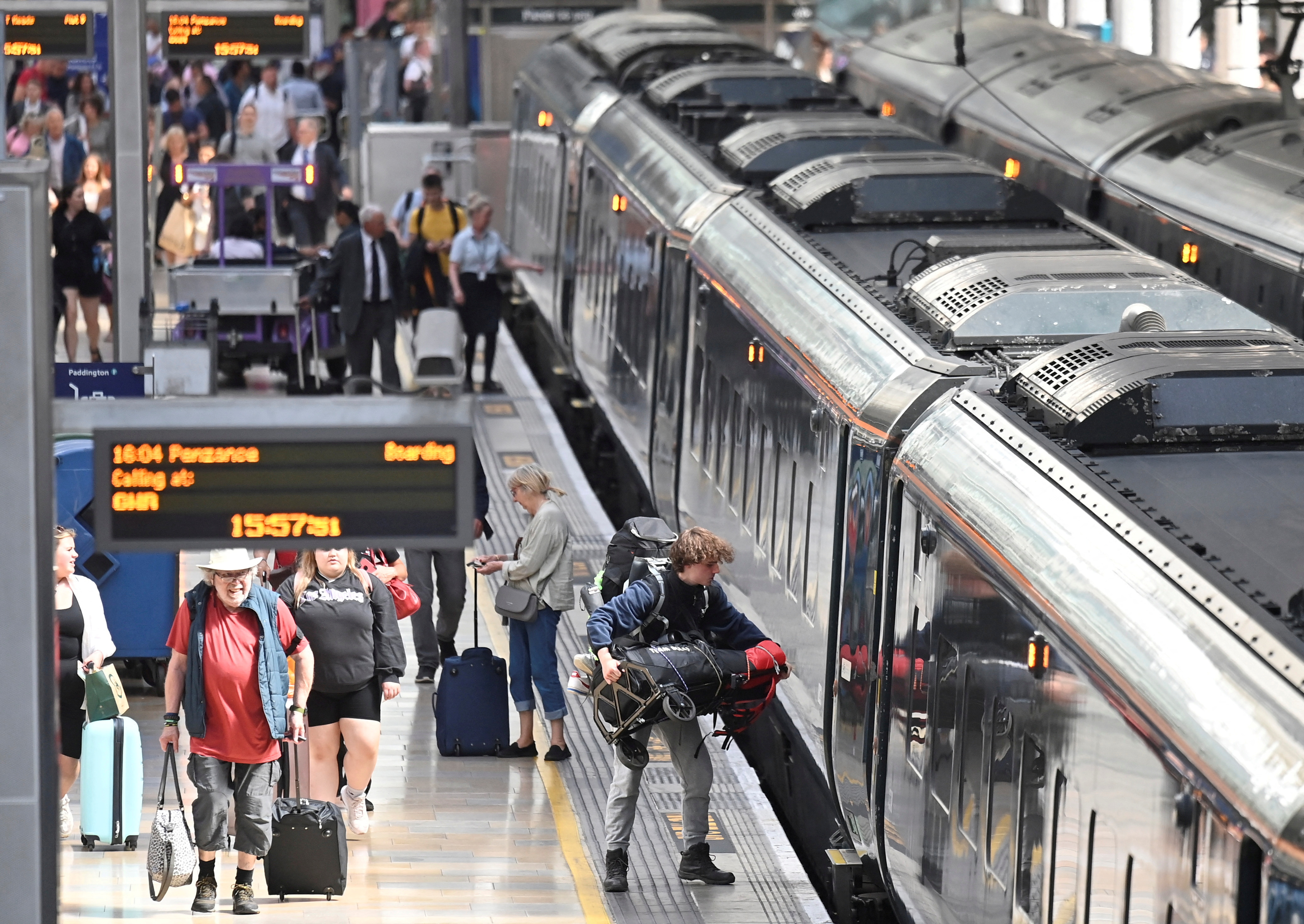 Passengers travel ahead of planned national rail worker strike, in London