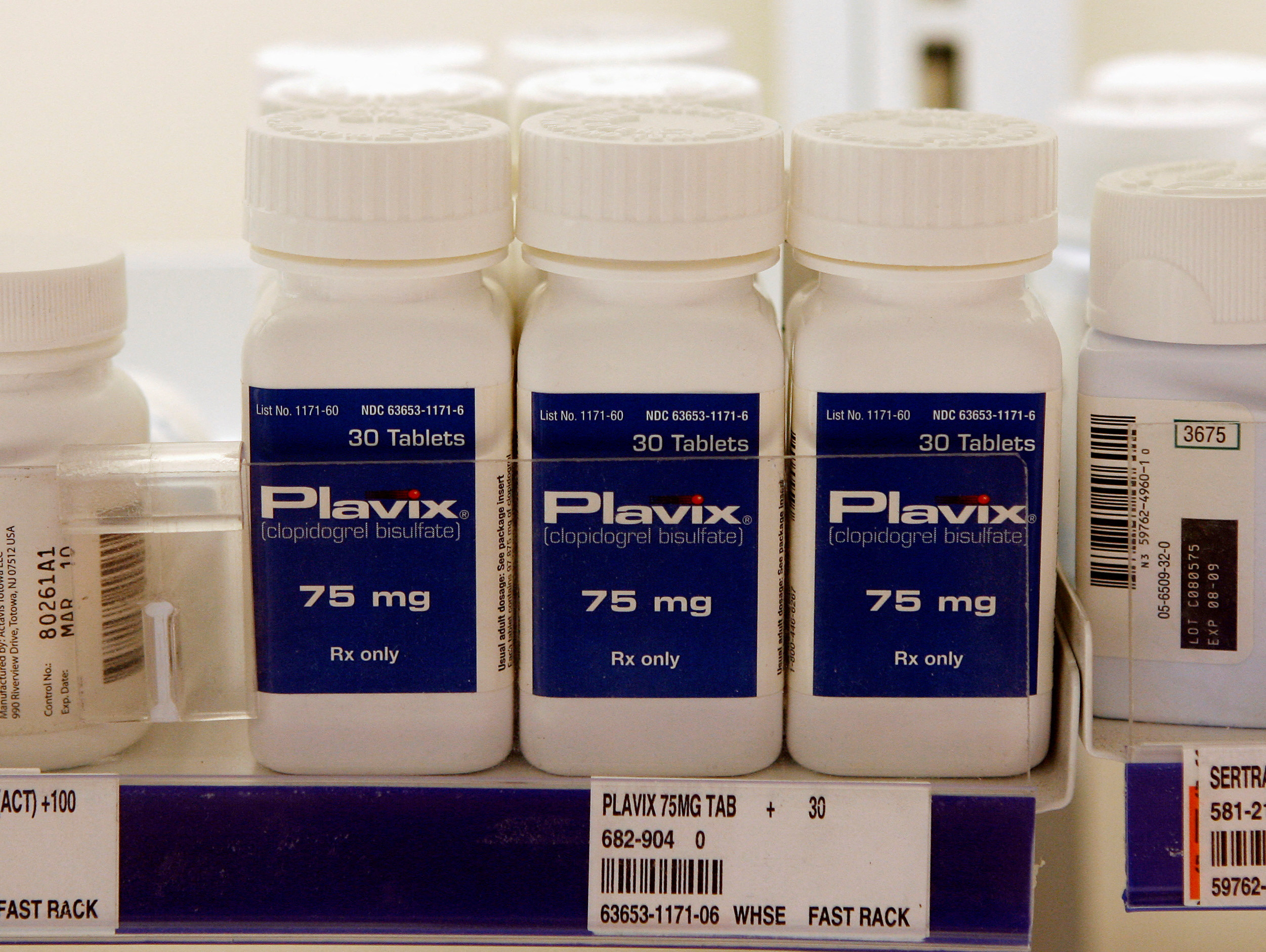 Bottles of Plavix are displayed on the shelves at a pharmacy in North Aurora, Illinois.