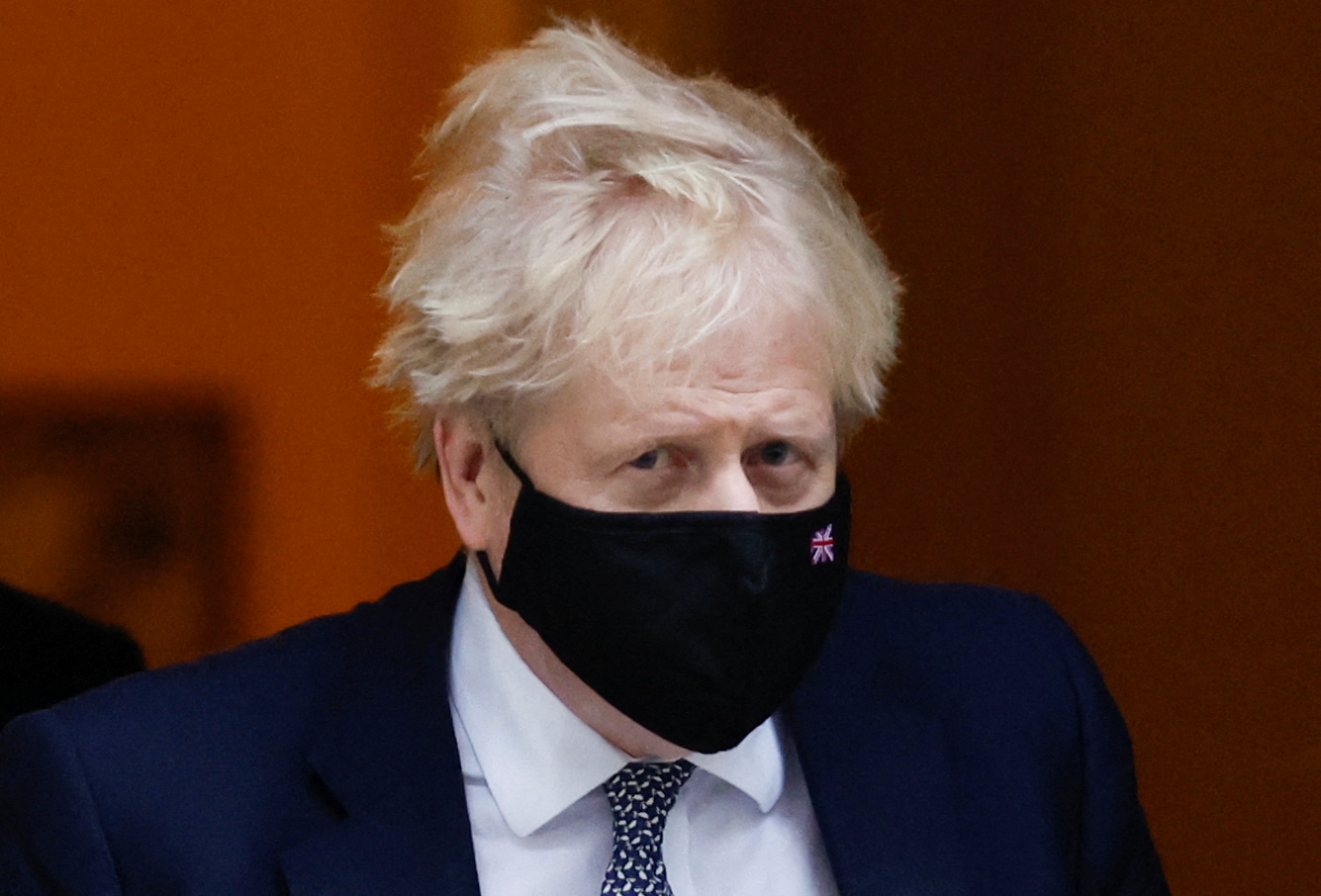 British Prime Minister Boris Johnson walks outside Downing Street in London, Britain, January 25, 2022. REUTERS/Peter Cziborra
