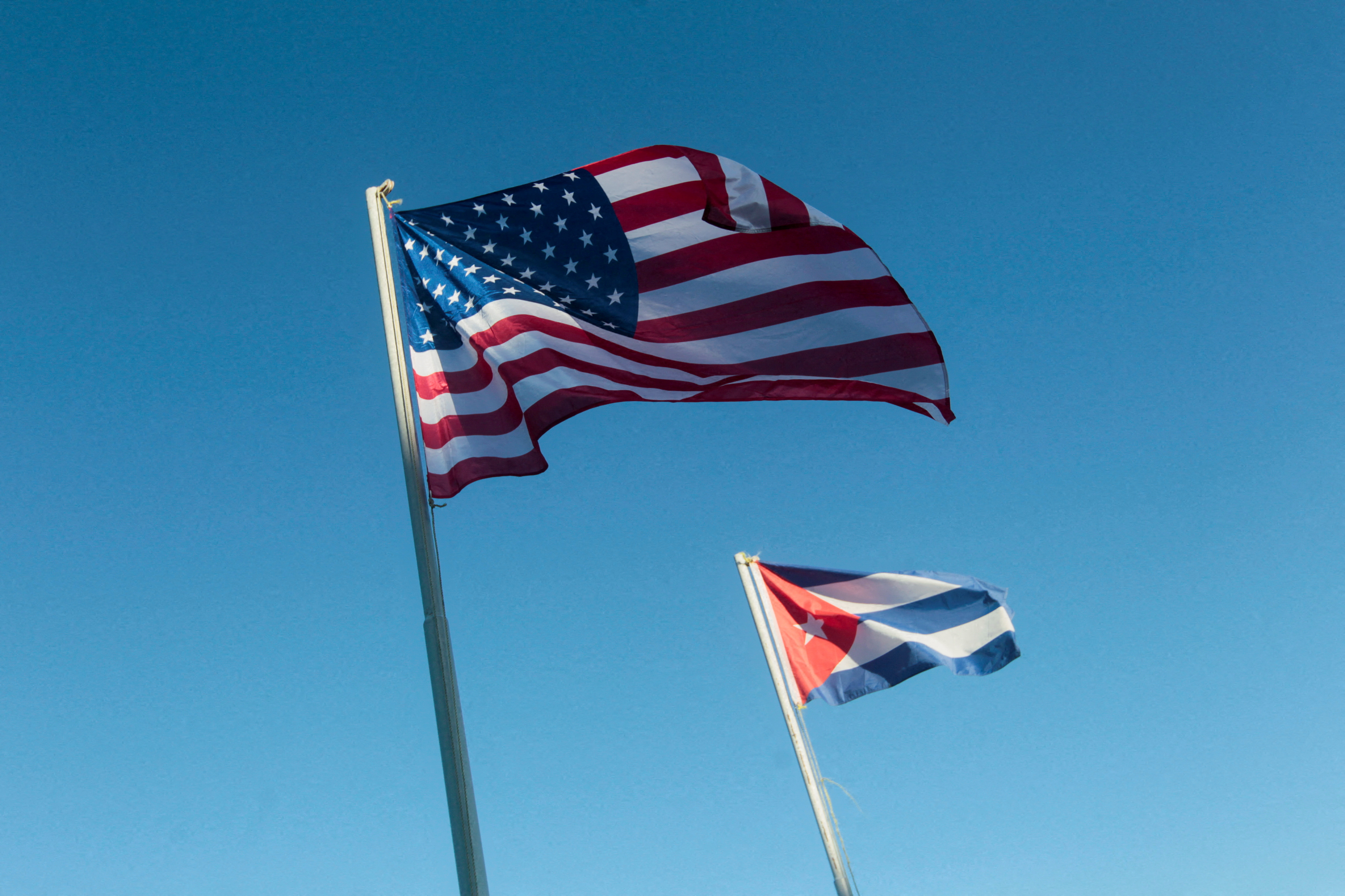 U.S. and Cuban flags hang outside a hotel in Havana