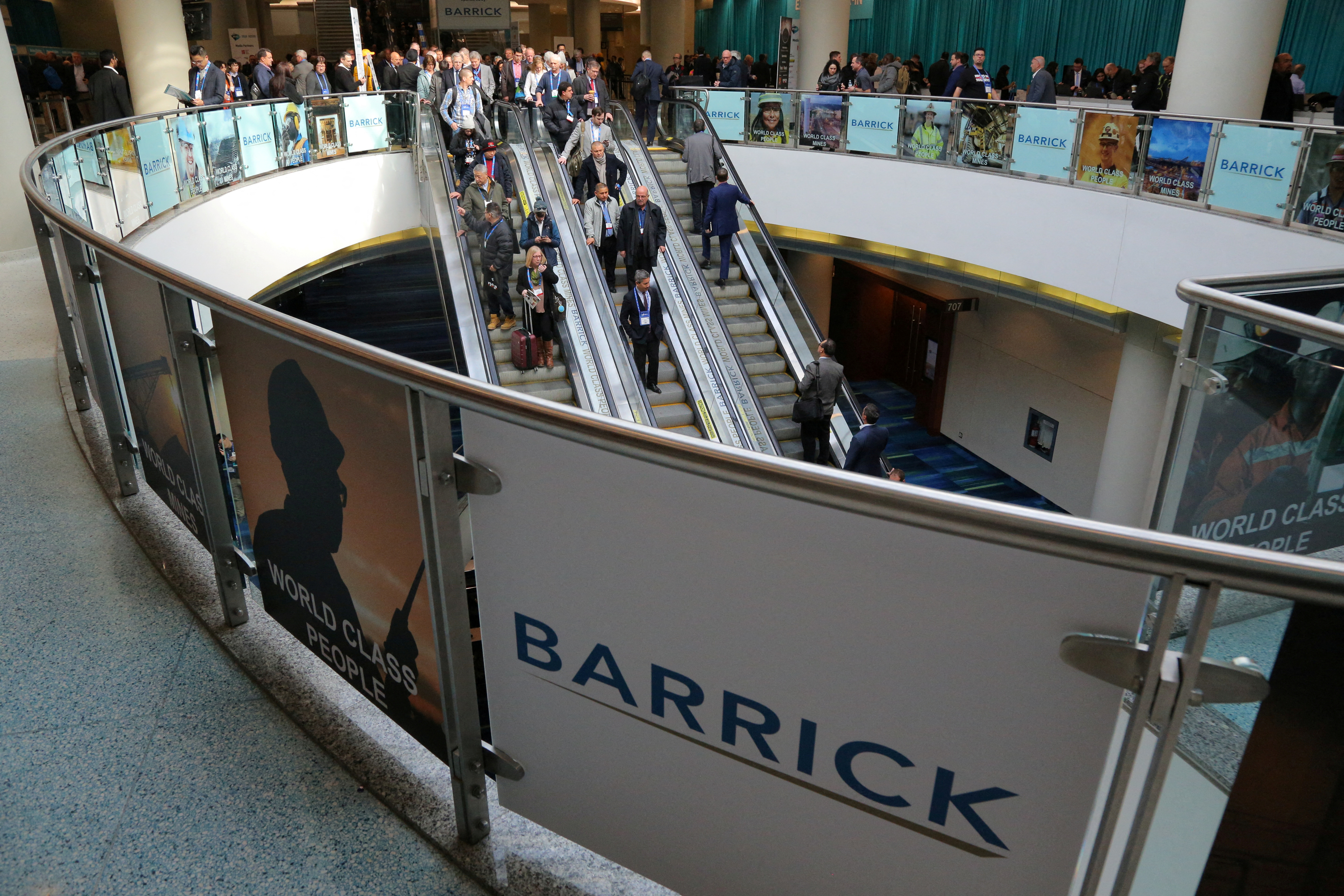 The logo of sponsor Barrick Gold Corporation is seen as visitors arrive during the PDAC convention in Toronto