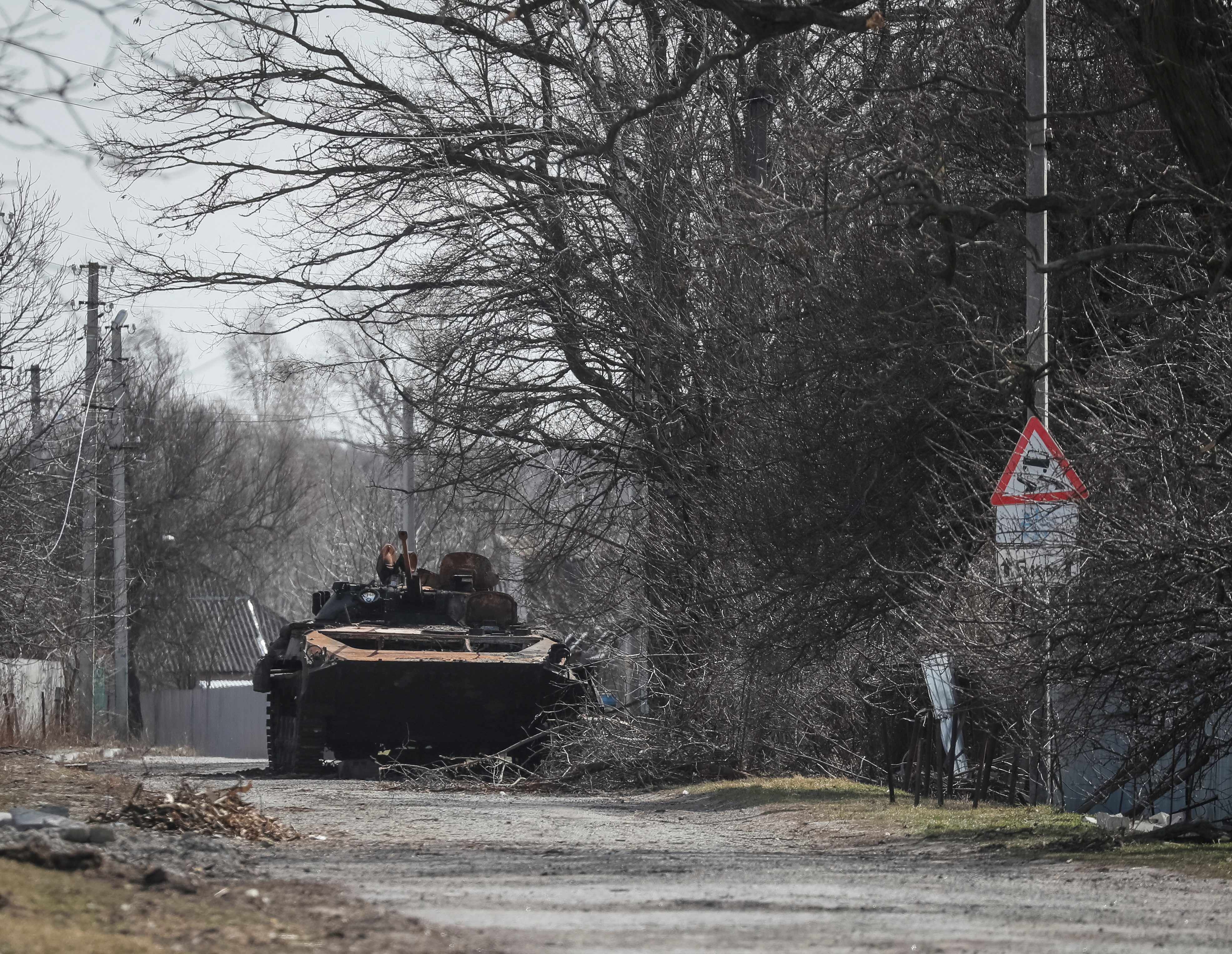 A wreck of a Russian Armoured Personnel Carriers is seen on the front line in the Kyiv region