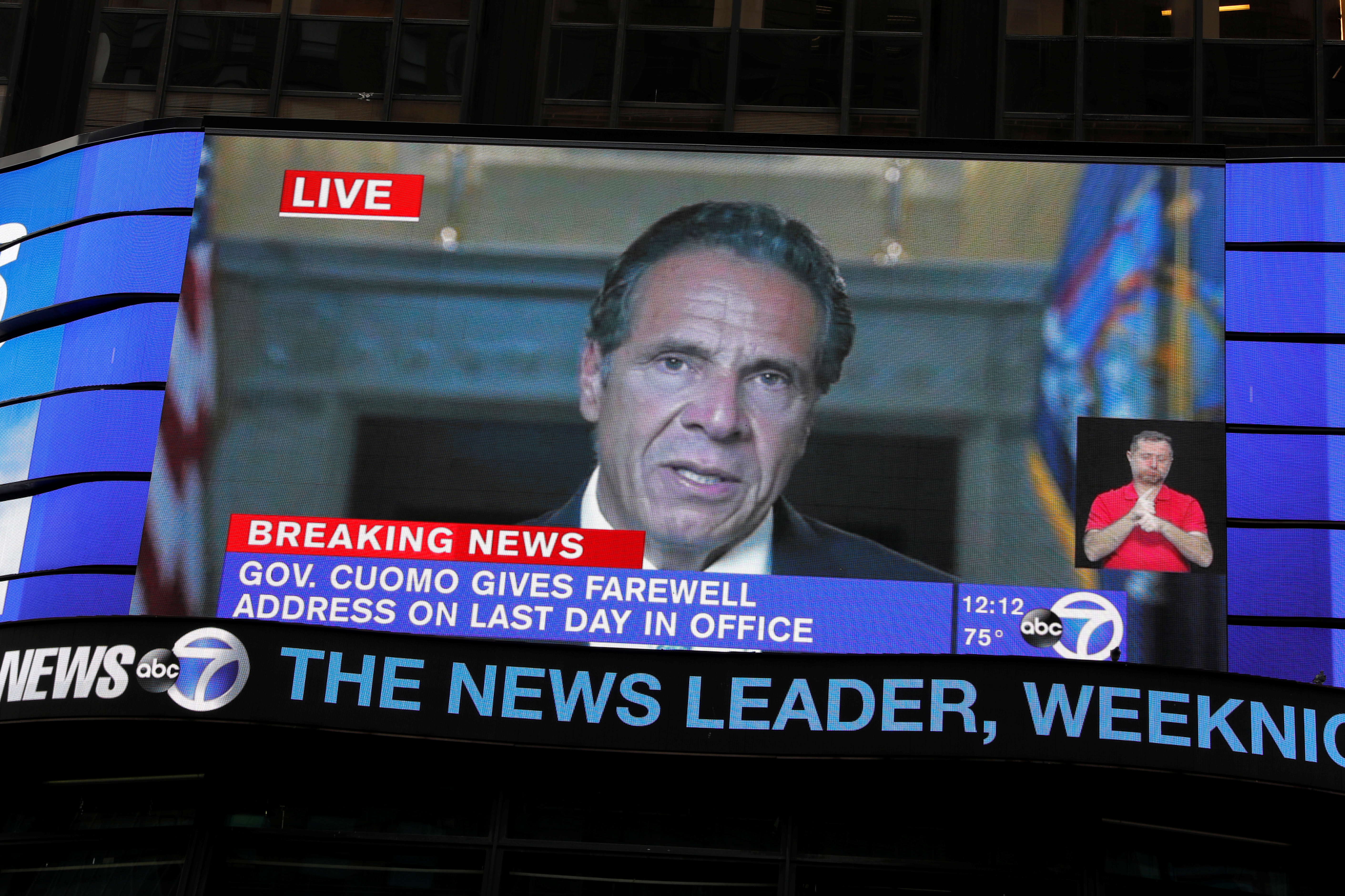 A farewell speech by New York Governor Andrew Cuomo is broadcast live on a screen in Times Square on his final day in office in Manhattan, New York City