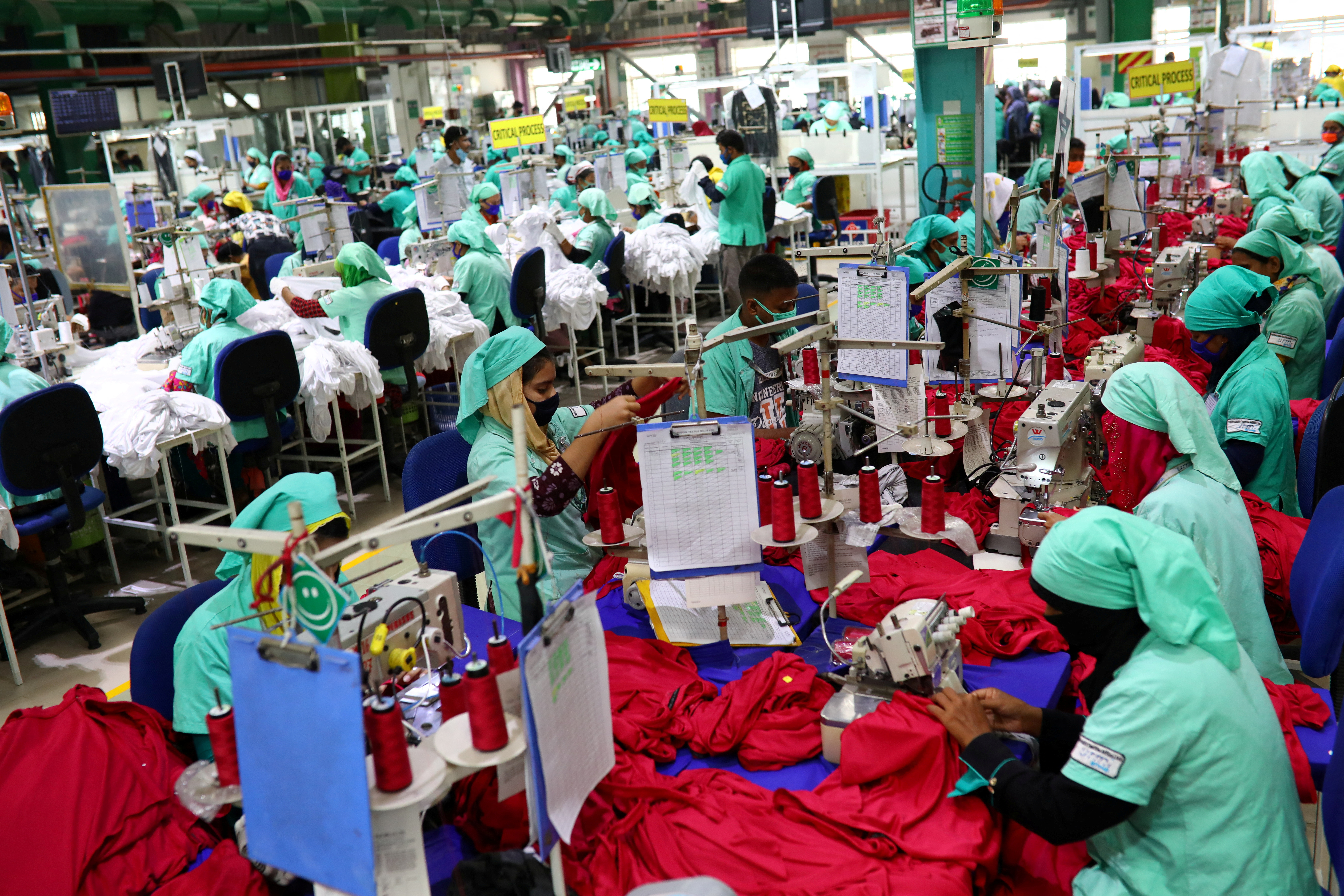 Garment employees work in a sewing section of the Fakhruddin Textile Mills Limited in Gazipur