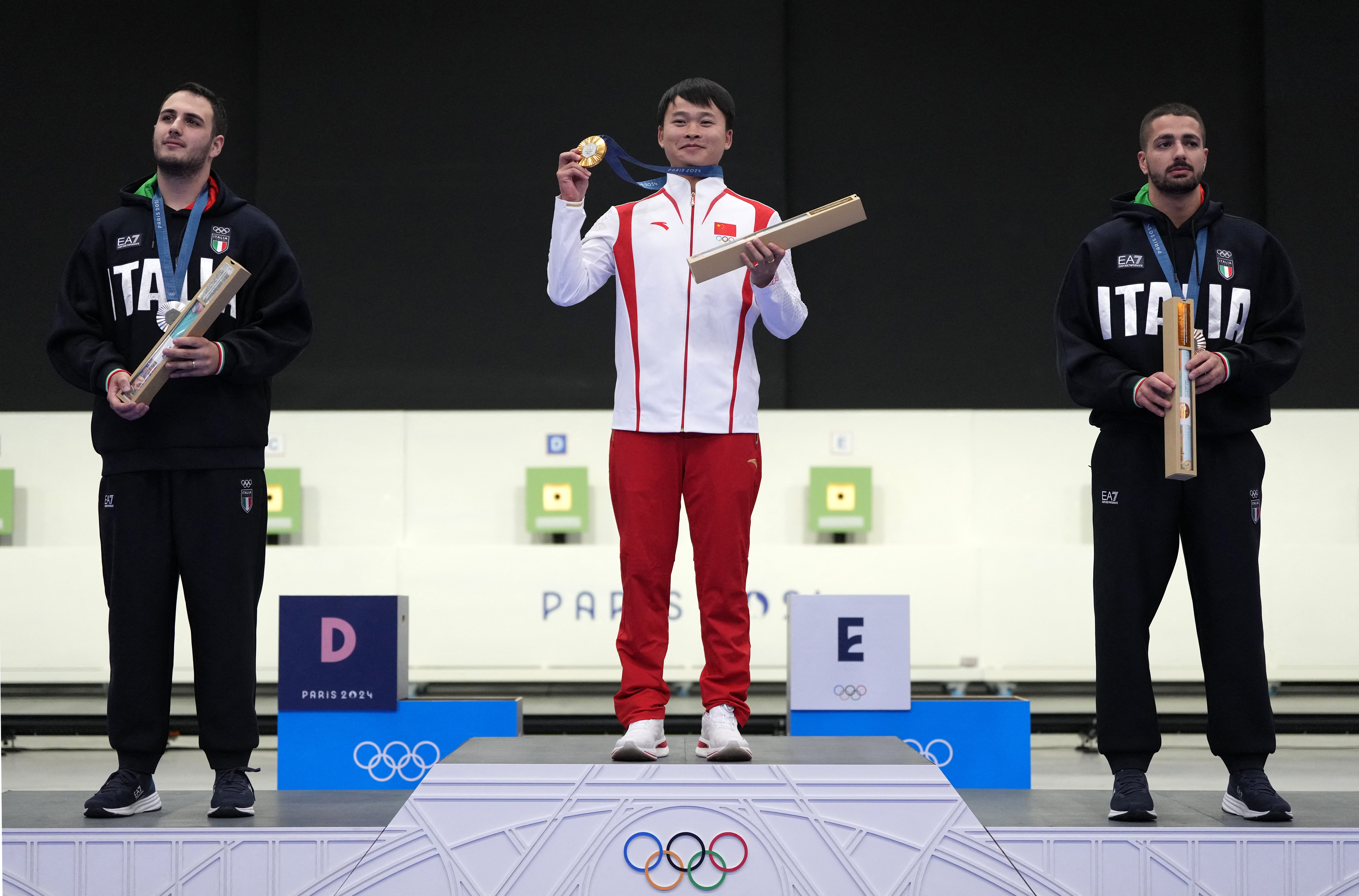 China's Xie Yu shoots gold in dream debut | Reuters