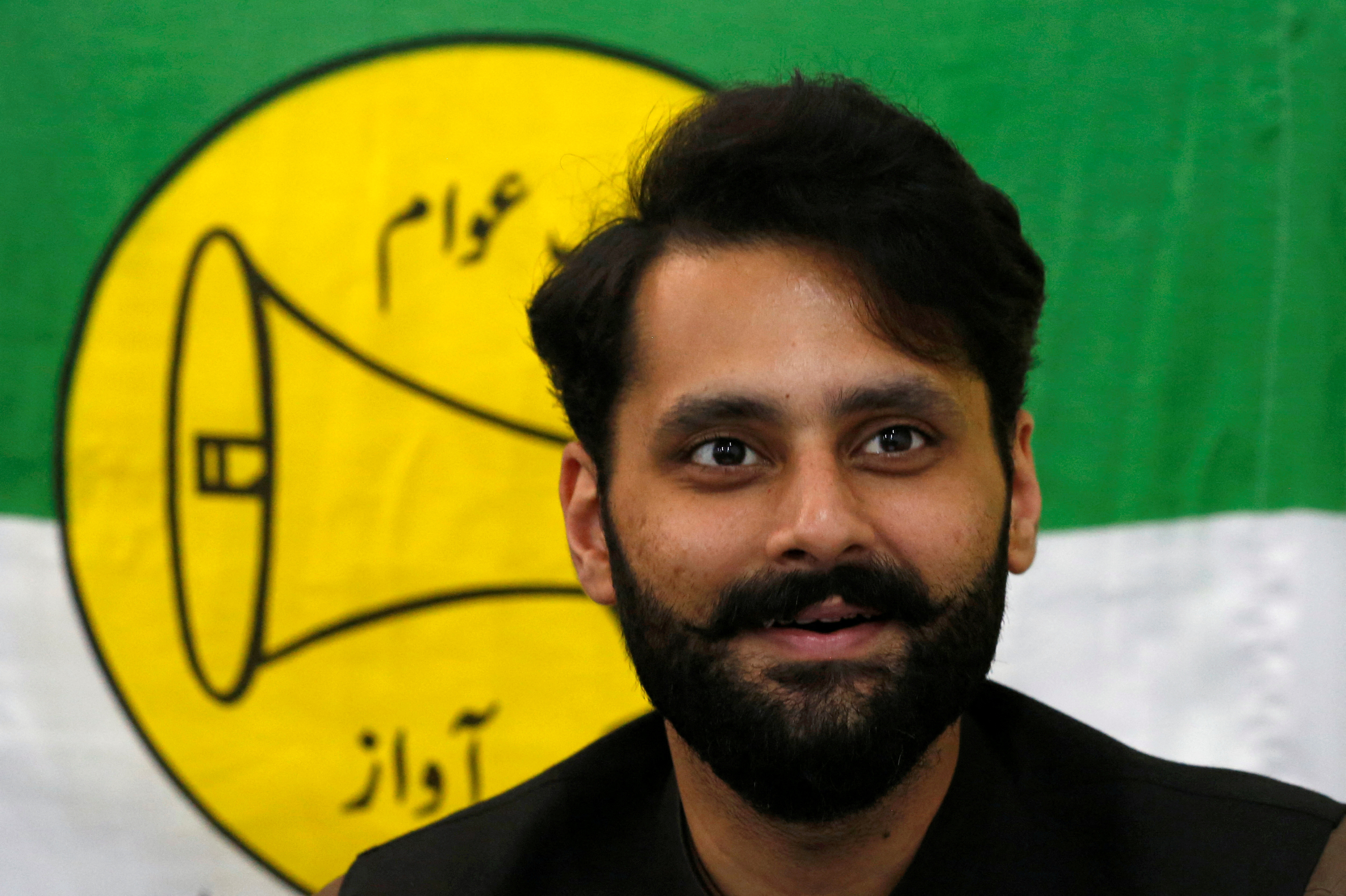 Jibran Nasir, a human rights lawyer and independent candidate for general election, speaks at his office in Karachi