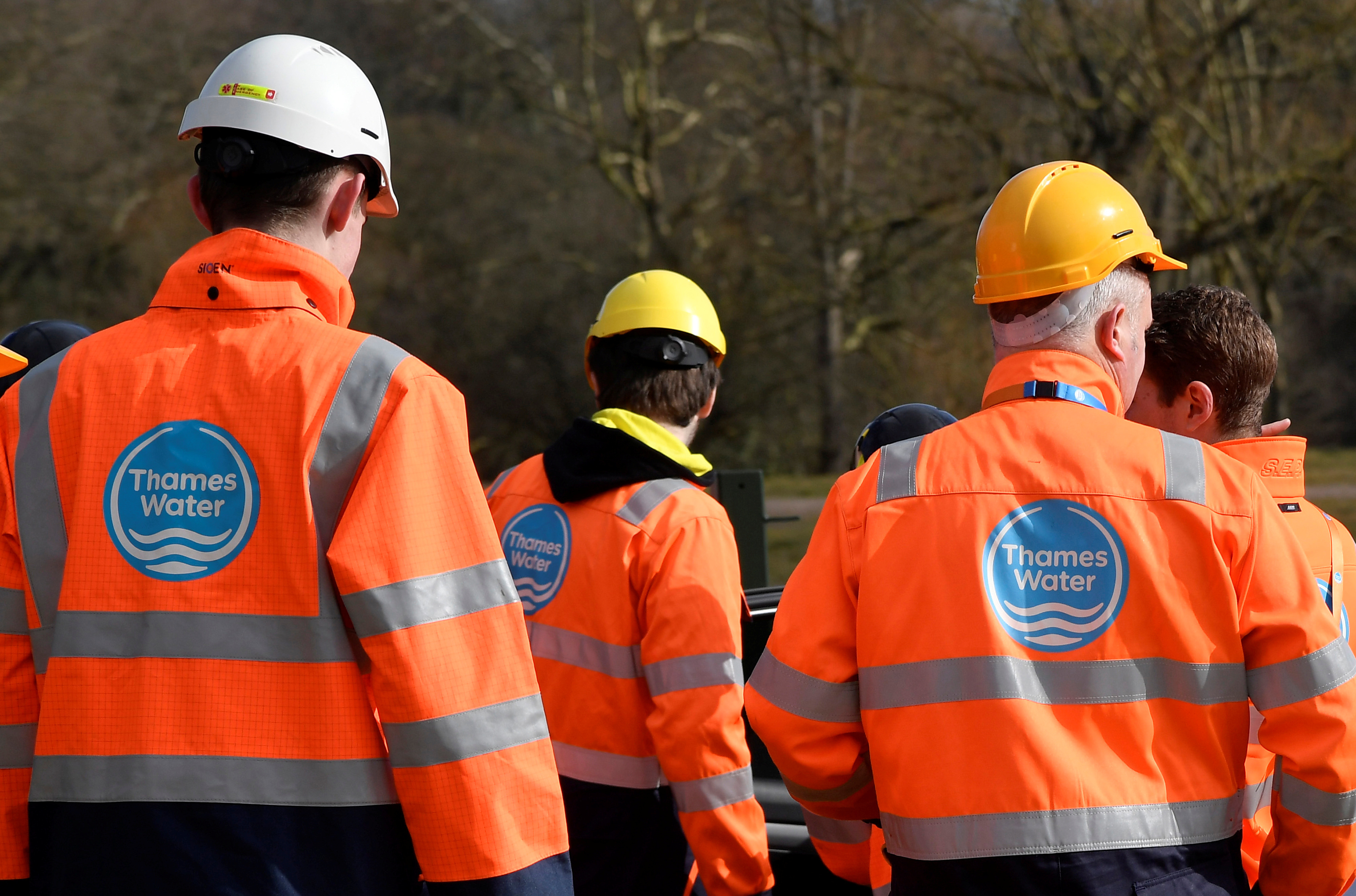 Thames Water operatives are seen at a water distribution site in Hampstead in London, Britain