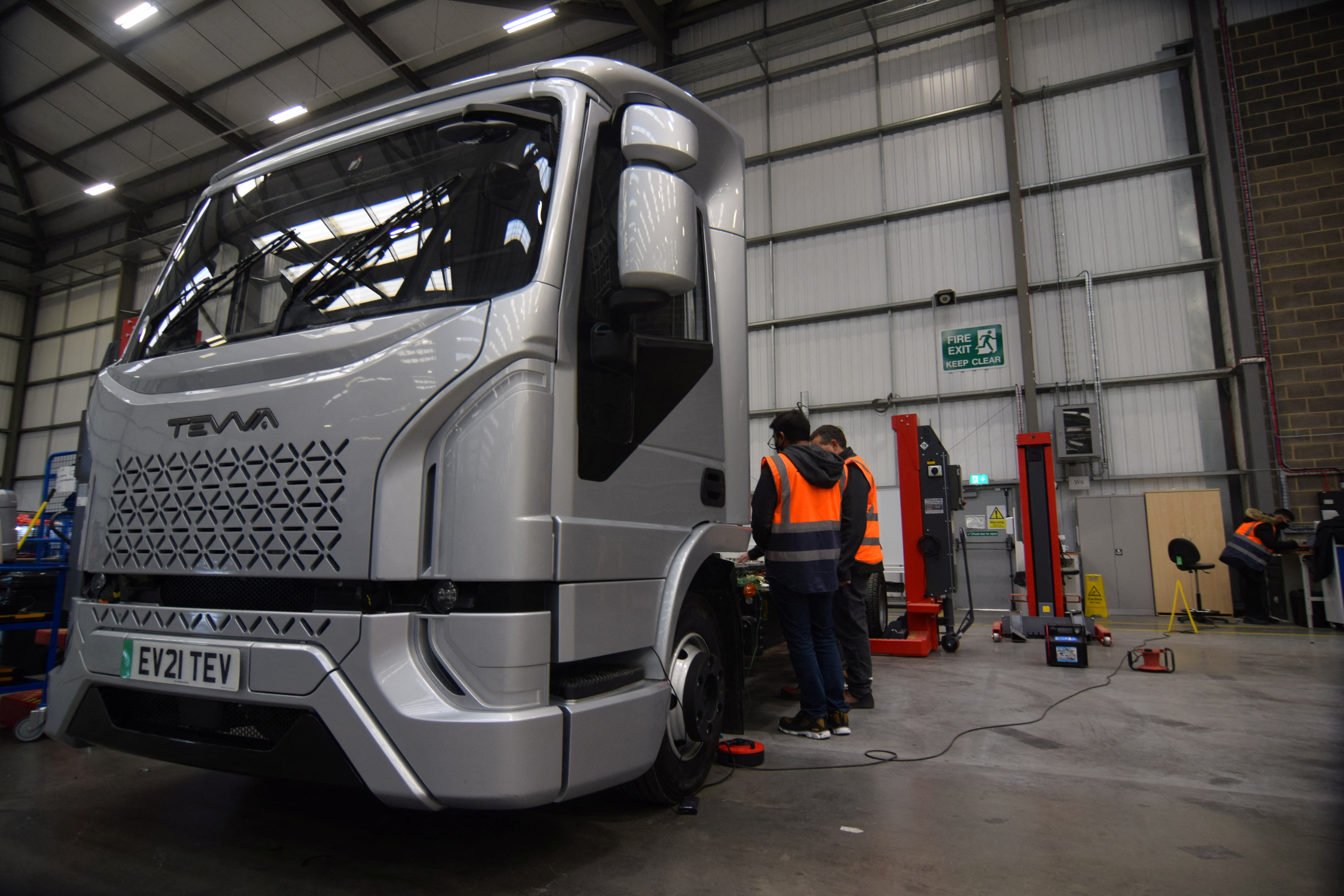 Engineers at electric maker Tevva work on a pre-production prototype truck at the startup's UK plant in Tilbury