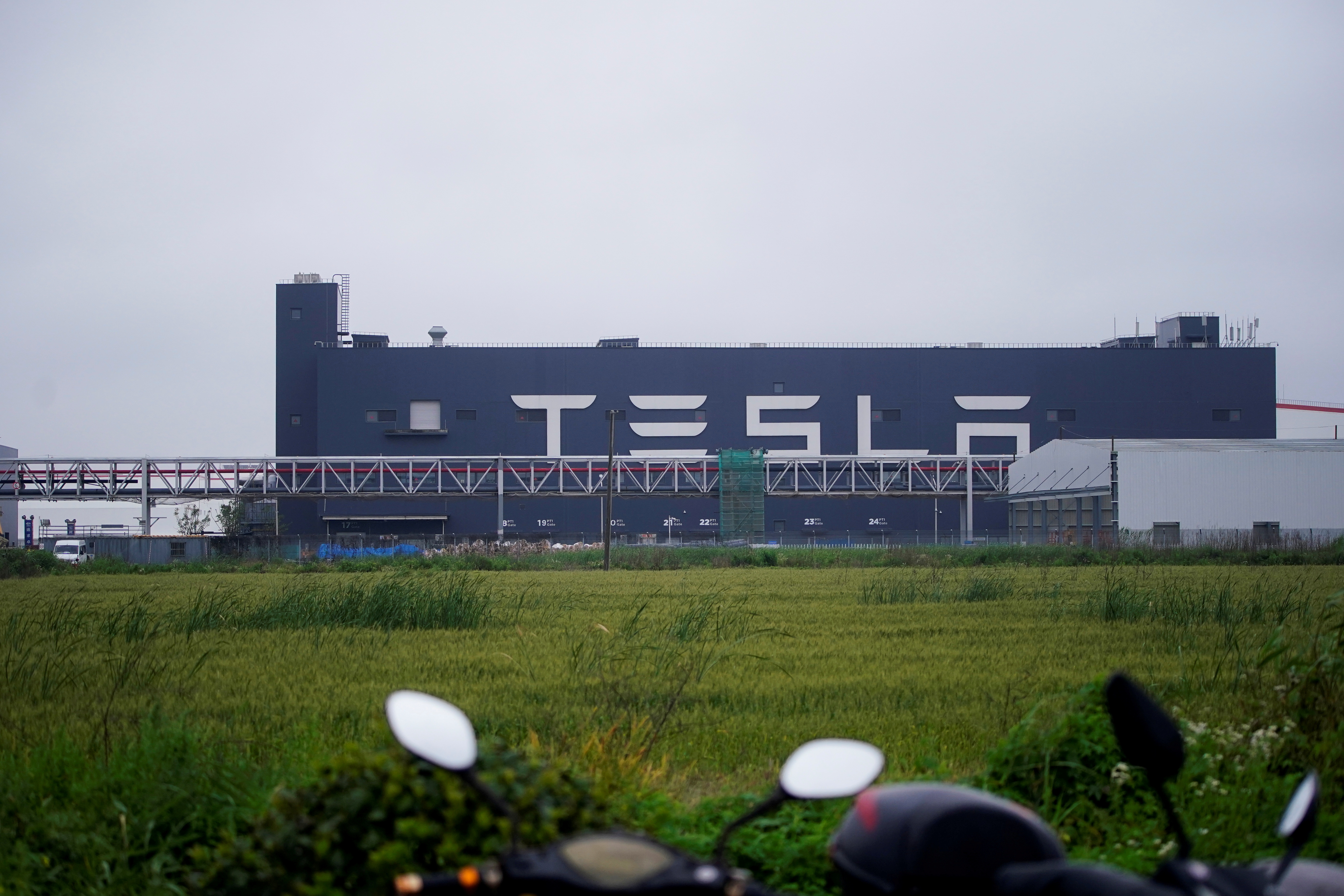 A Tesla sign is seen at the U.S. electric vehicle maker's factory in Shanghai, China, May 13, 2021. REUTERS/Aly Song