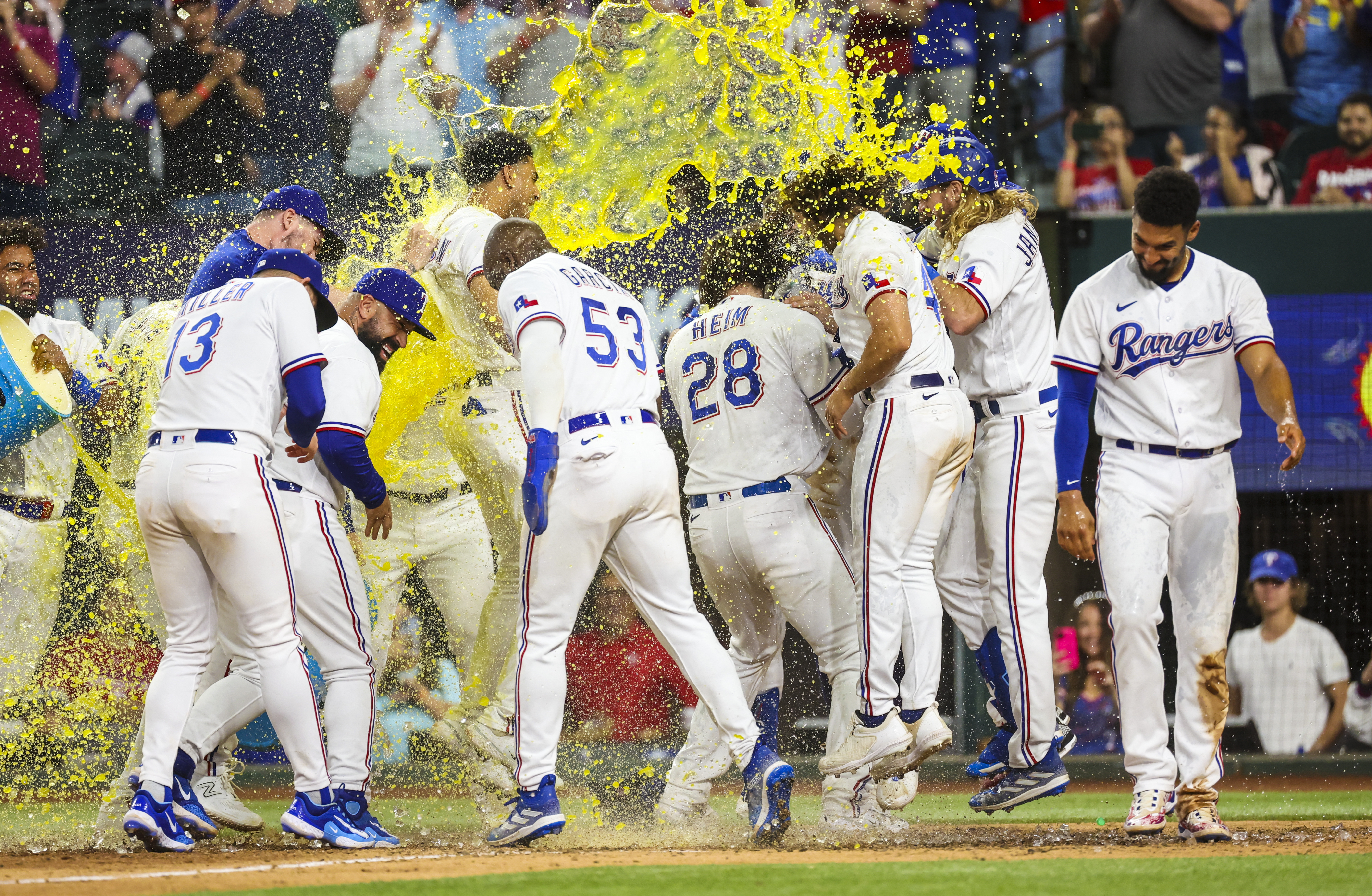 Rangers rally in 10th for walk-off victory over Royals
