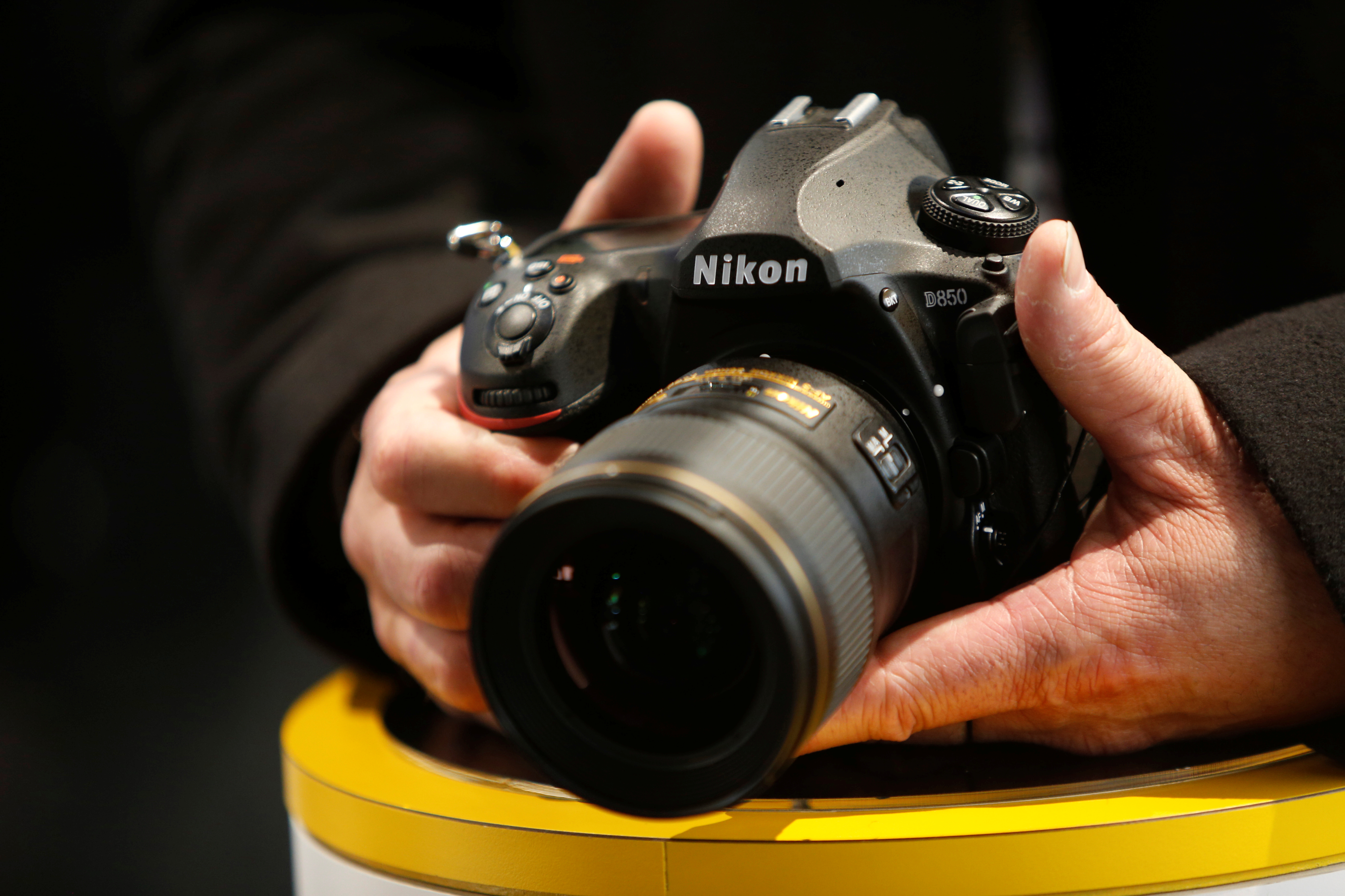 An attendee checks out the Nikon D850 digital camera during the 2018 CES in Las Vegas