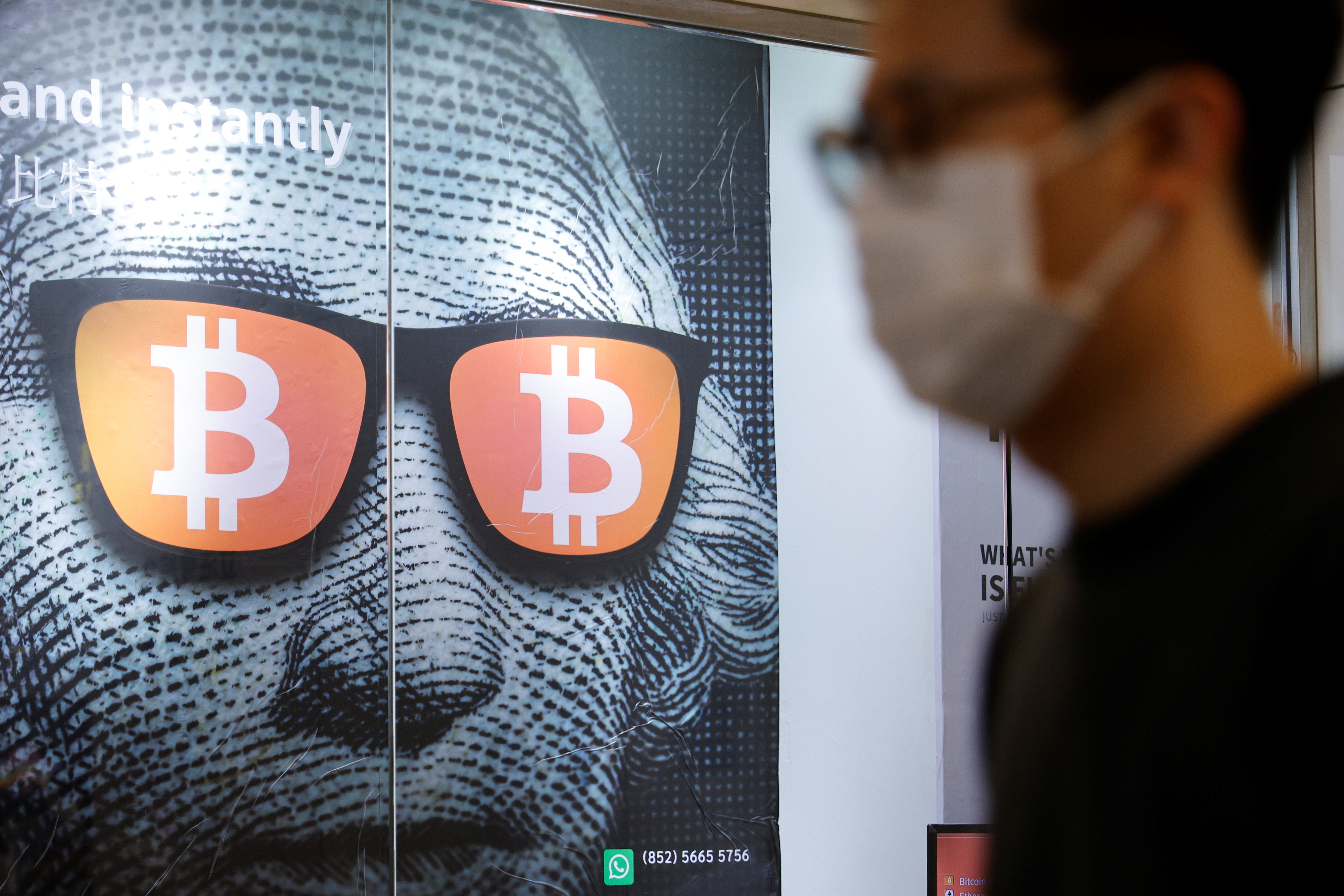 An advertisement for Bitcoin and cryptocurrencies is seen in Hong Kong