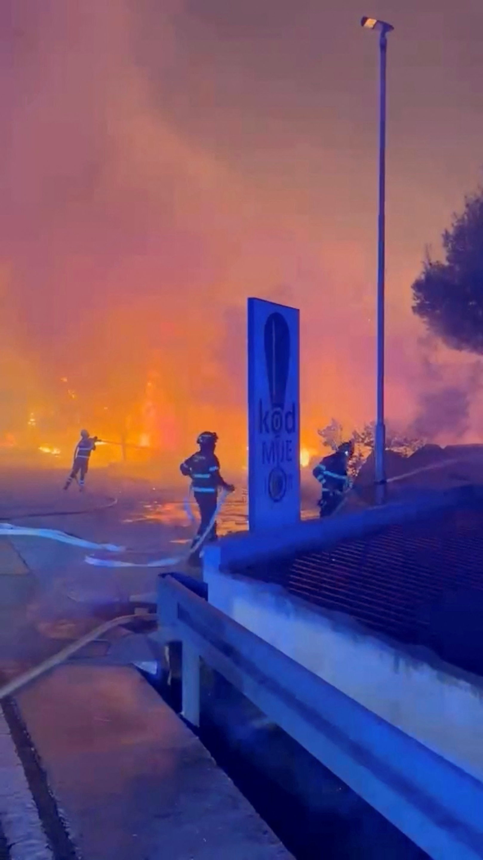 Germany evacuates about 1,800 as wildfire reaches border village; country singer Colt Ford injured in tour bus crash in Germany