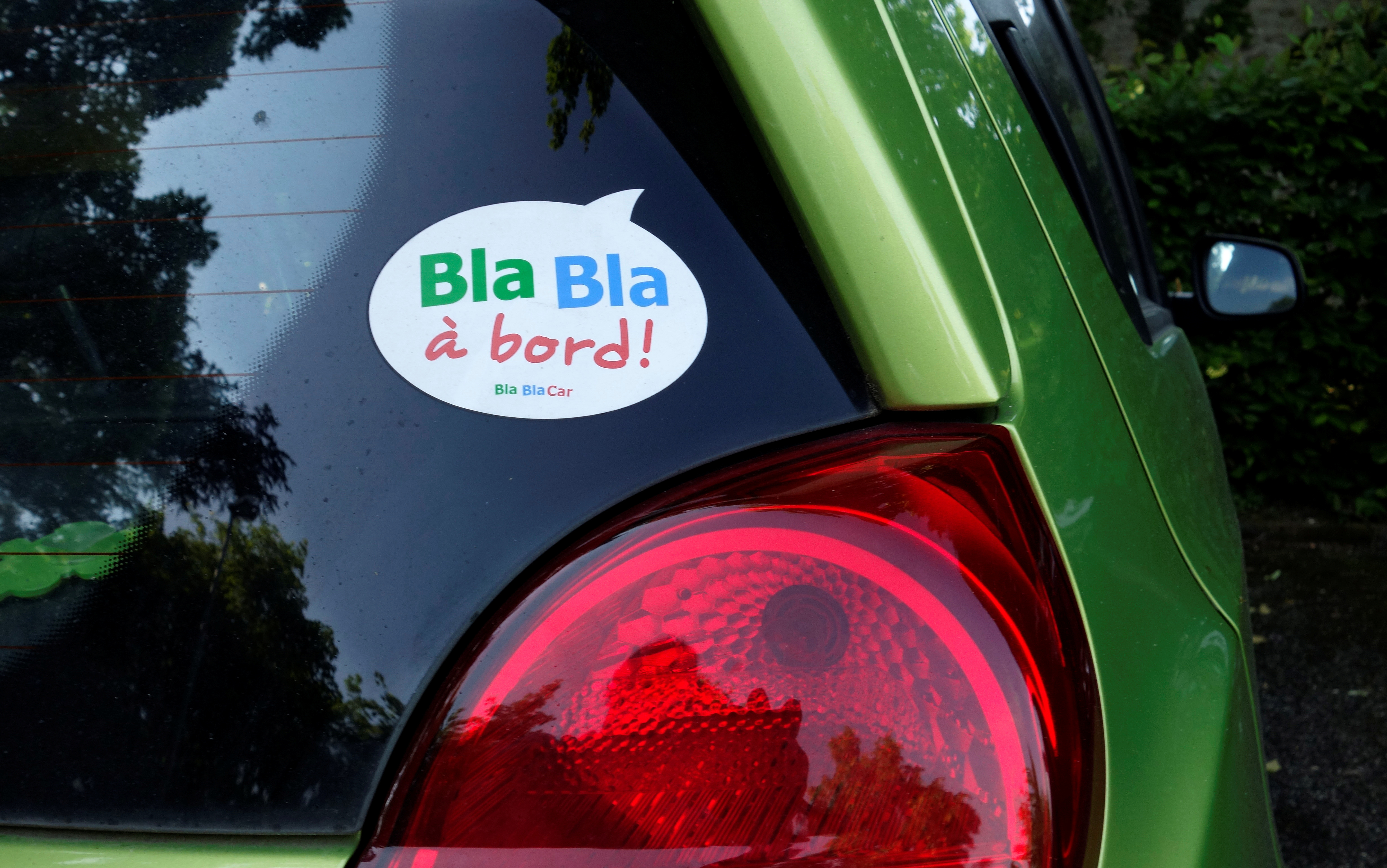A sticker of French ride-sharing start-up BlaBlaCar is seen on a car at Le Coudray-Montceaux