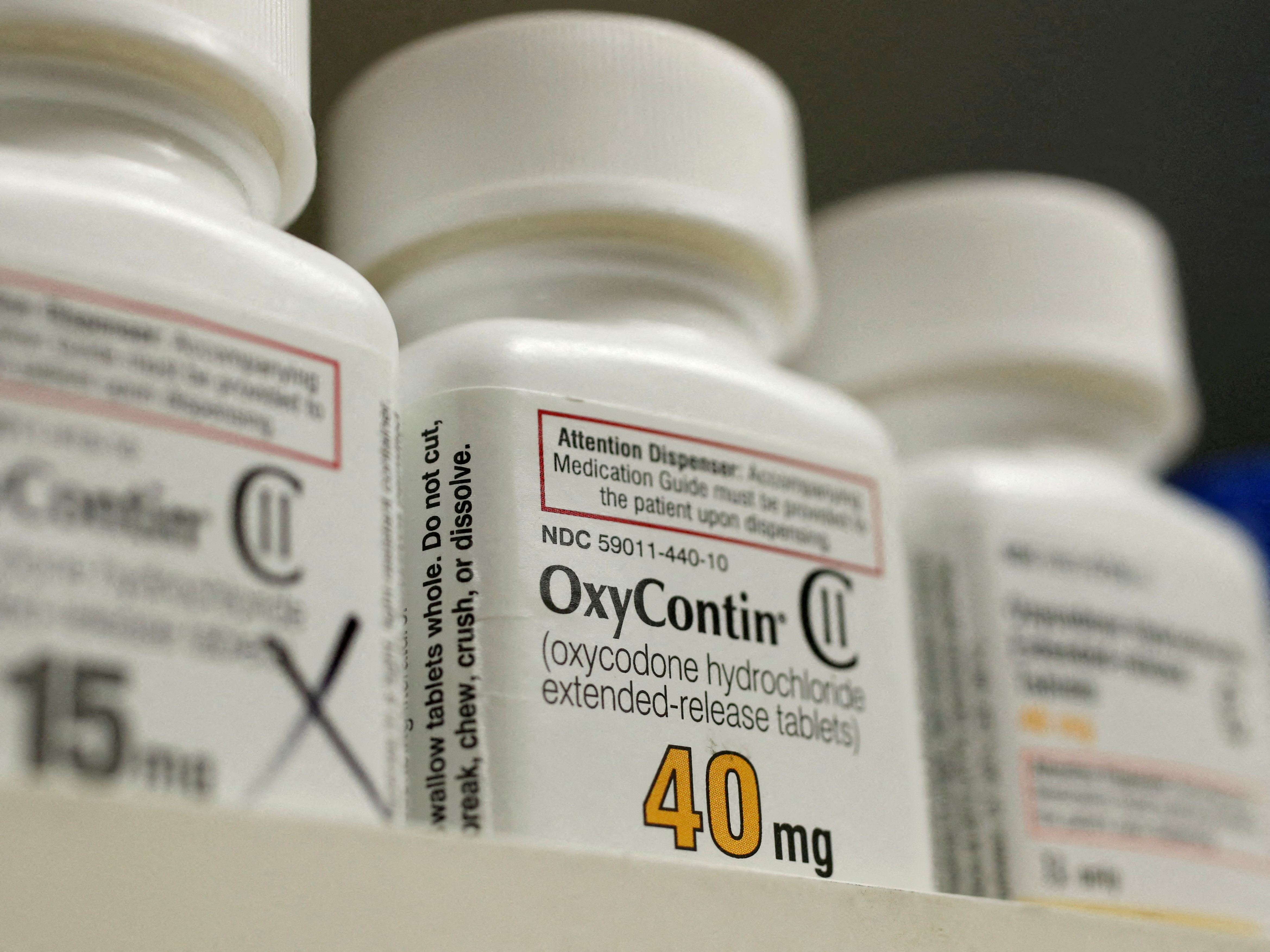 Bottles of prescription painkiller OxyContin, 40mg pills, made by Purdue Pharma L.D. sit on a shelf at a local pharmacy in Provo