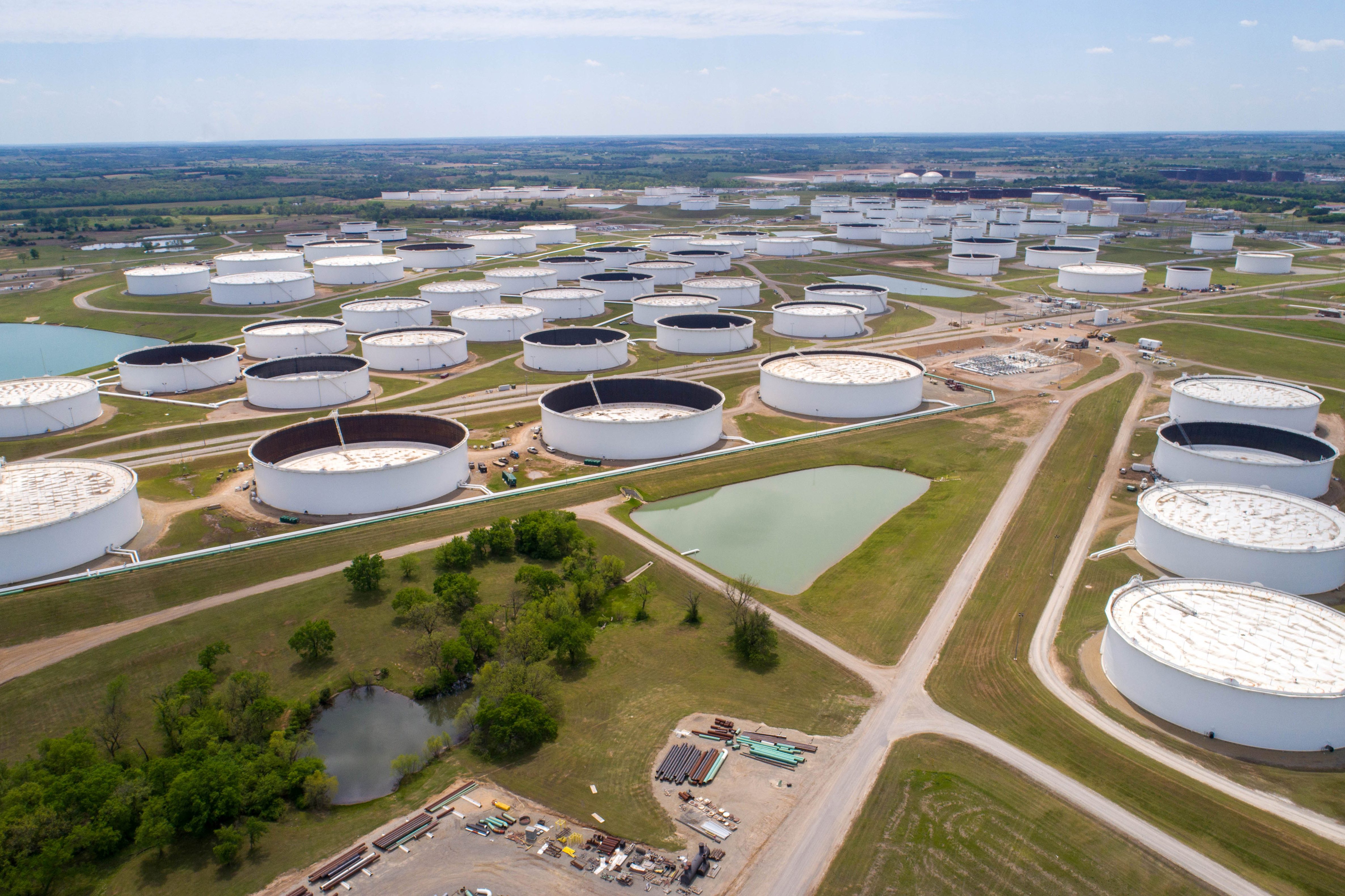 Crude oil storage tanks are seen in an aerial photograph at the Cushing oil hub in Cushing, Oklahoma, U.S. April 21, 2020. REUTERS/Drone Base